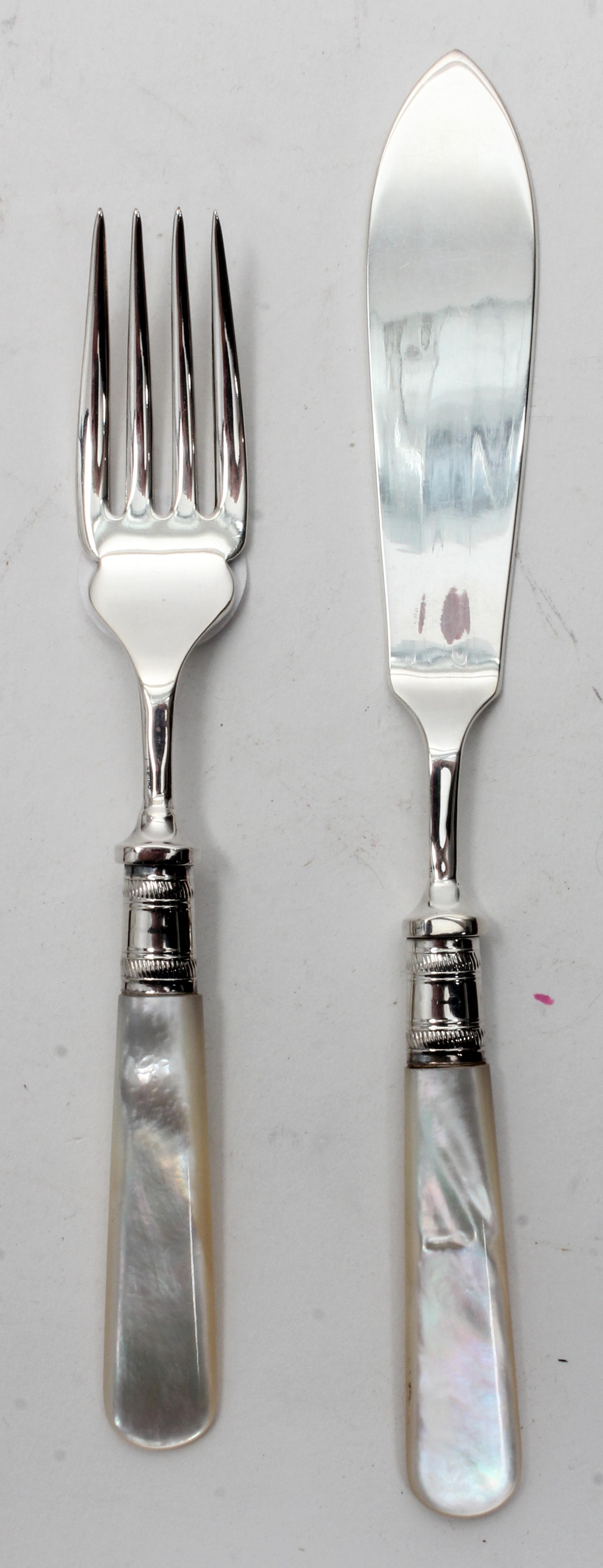 A Sheffield Plate Mother-of-Pearl Fish Service, , comprising six fish knives, and six fish forks.