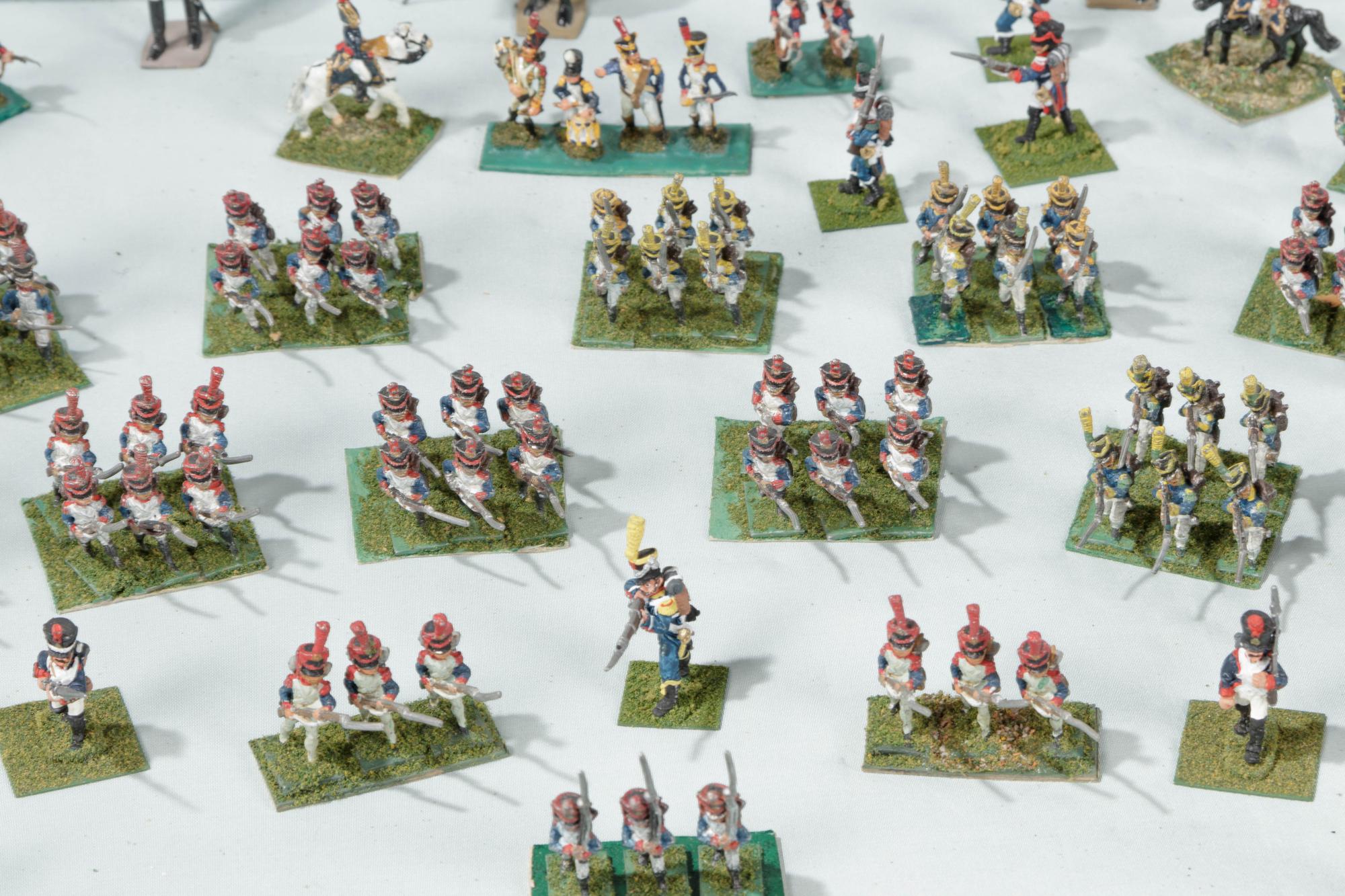 A Collection of Miniature Lead Soldiers in a Louis XV Style Vitrine Table