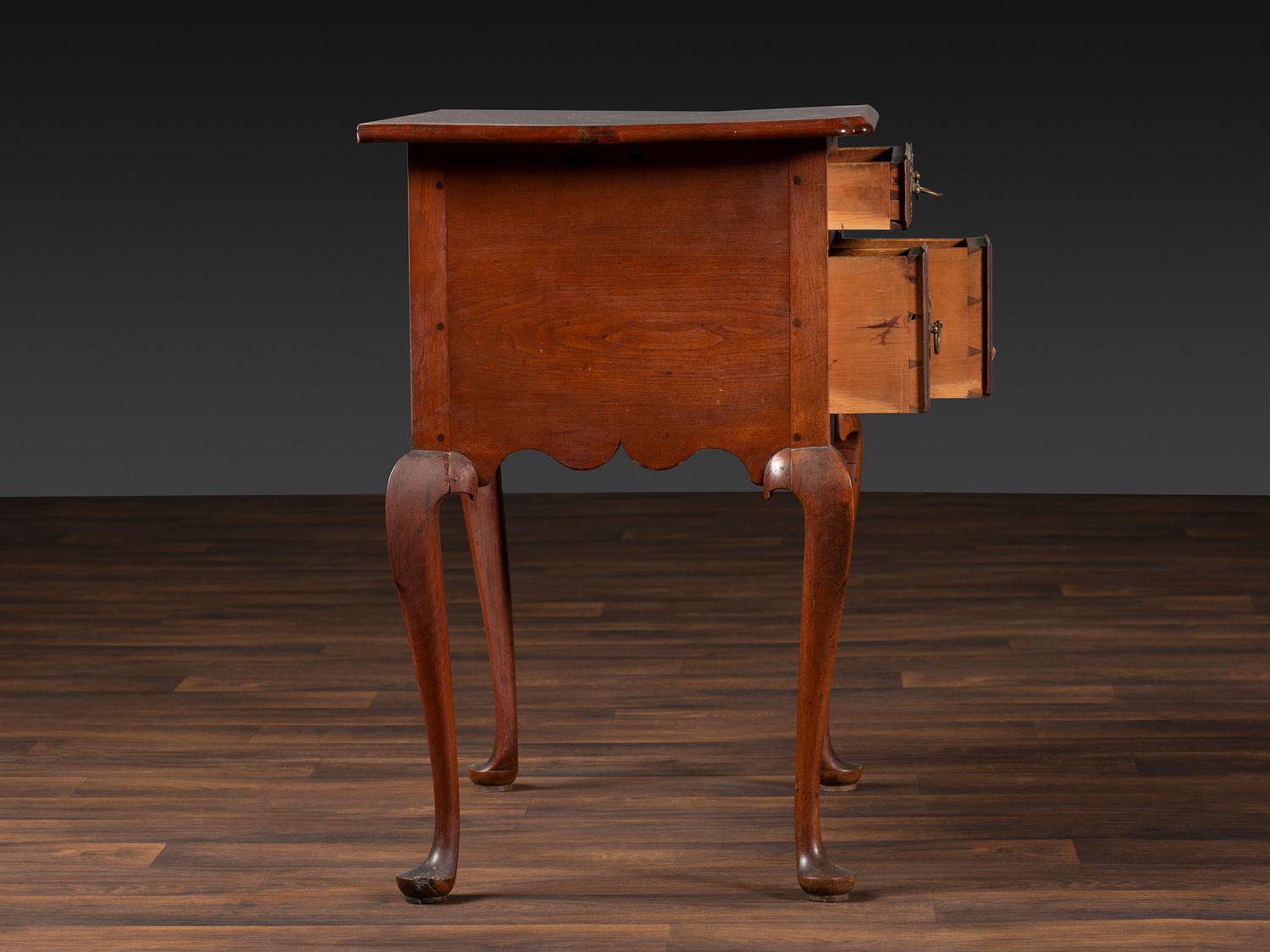 A Queen Anne Cherrywood and Maple Pad Foot Dressing Table