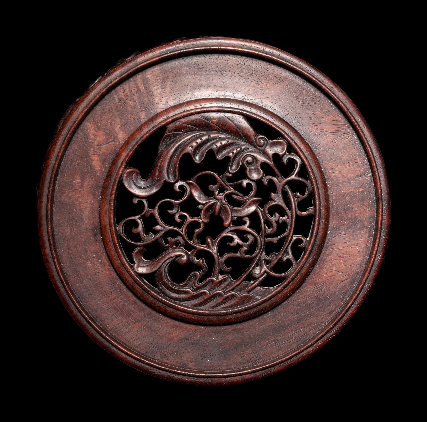 A Pair of Chinese Carved Hardwood Circular Stands