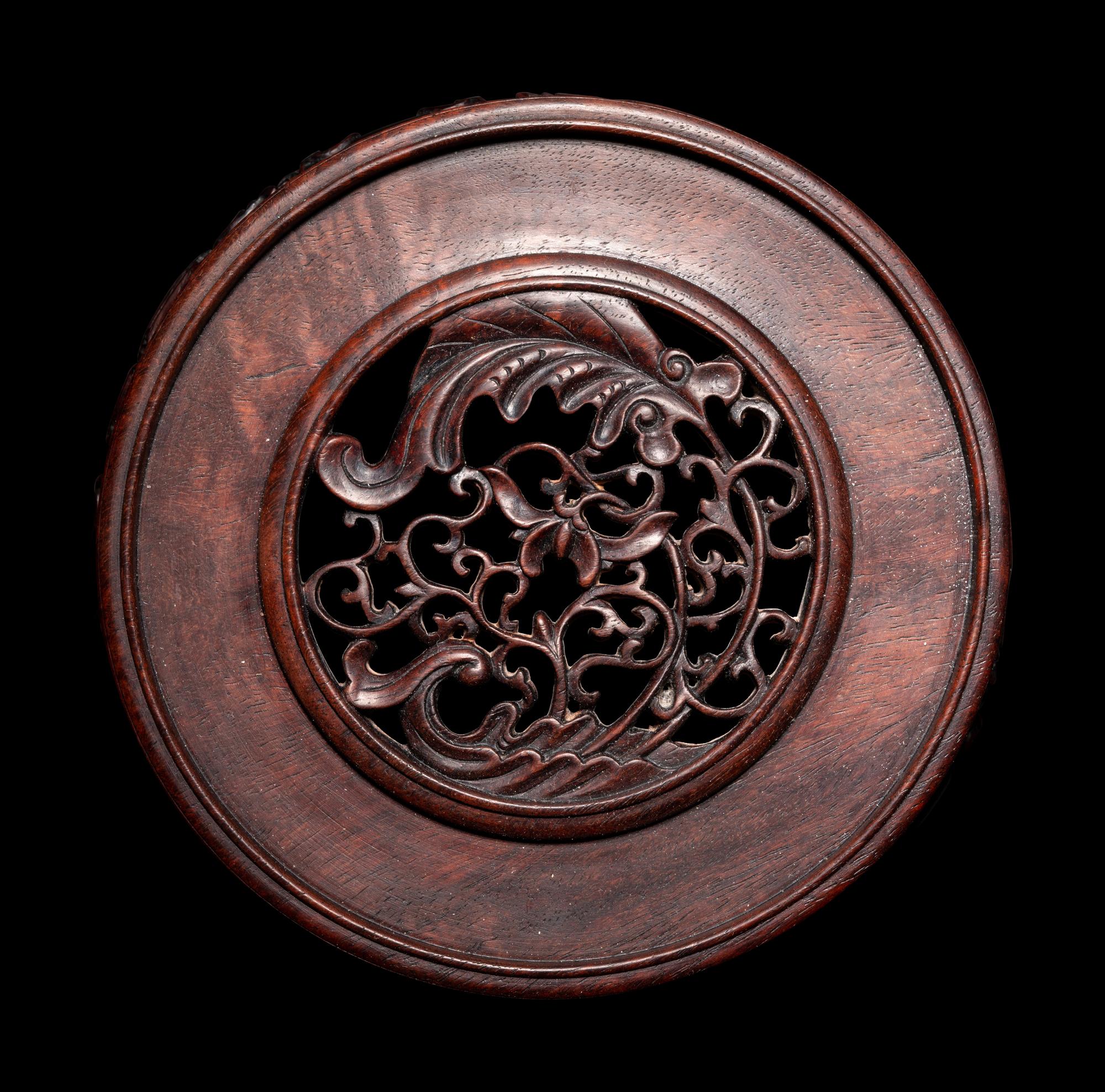 A Pair of Chinese Carved Hardwood Circular Stands