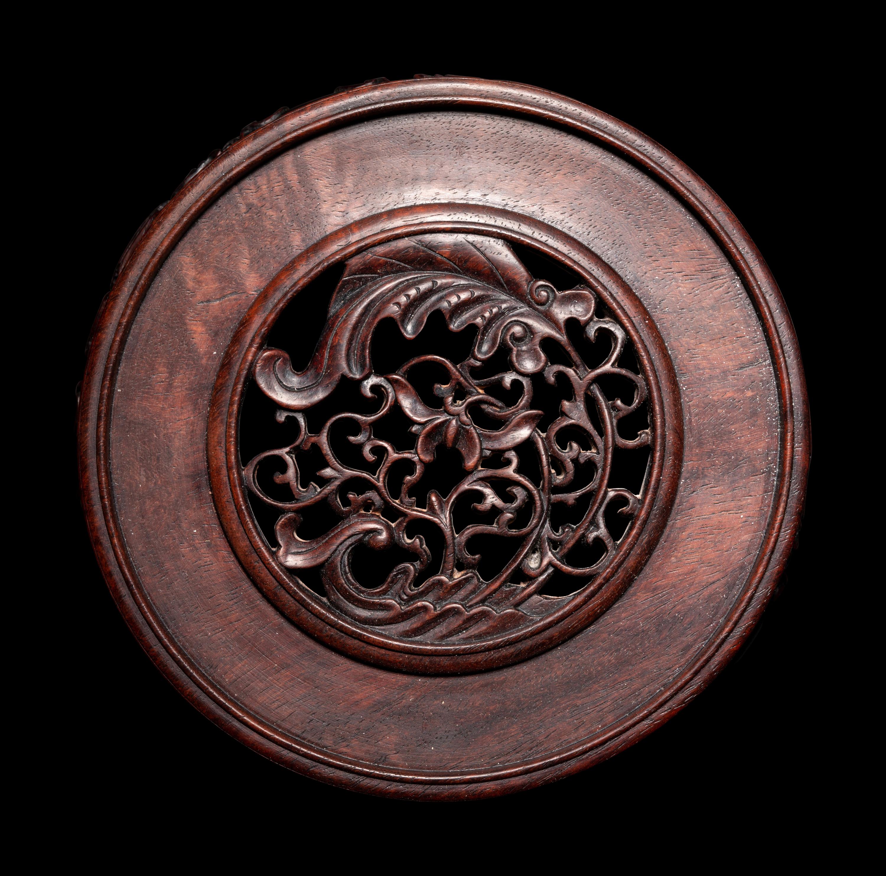 A Pair of Chinese Carved Hardwood Circular Stands