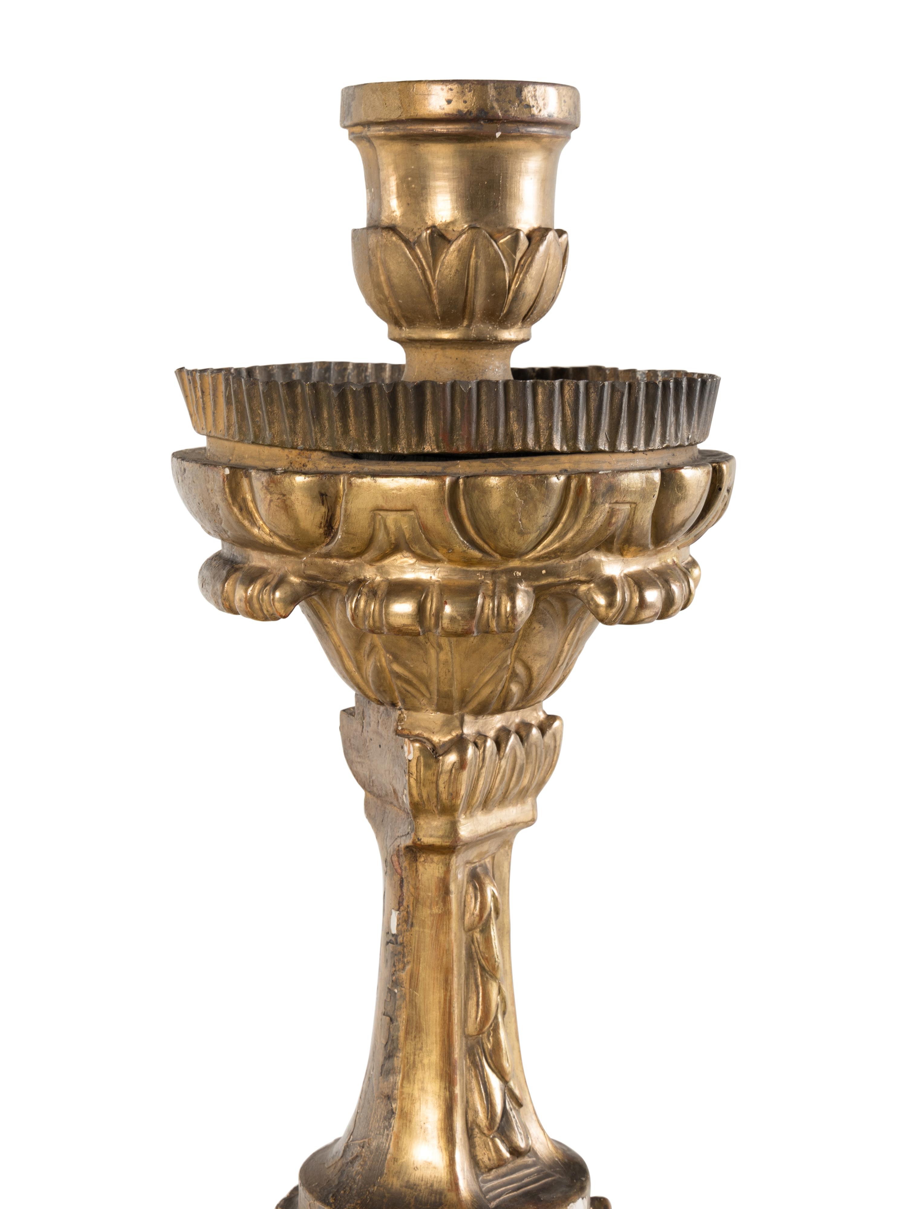A Set of Four Continental Baroque Style Carved Giltwood Torchères