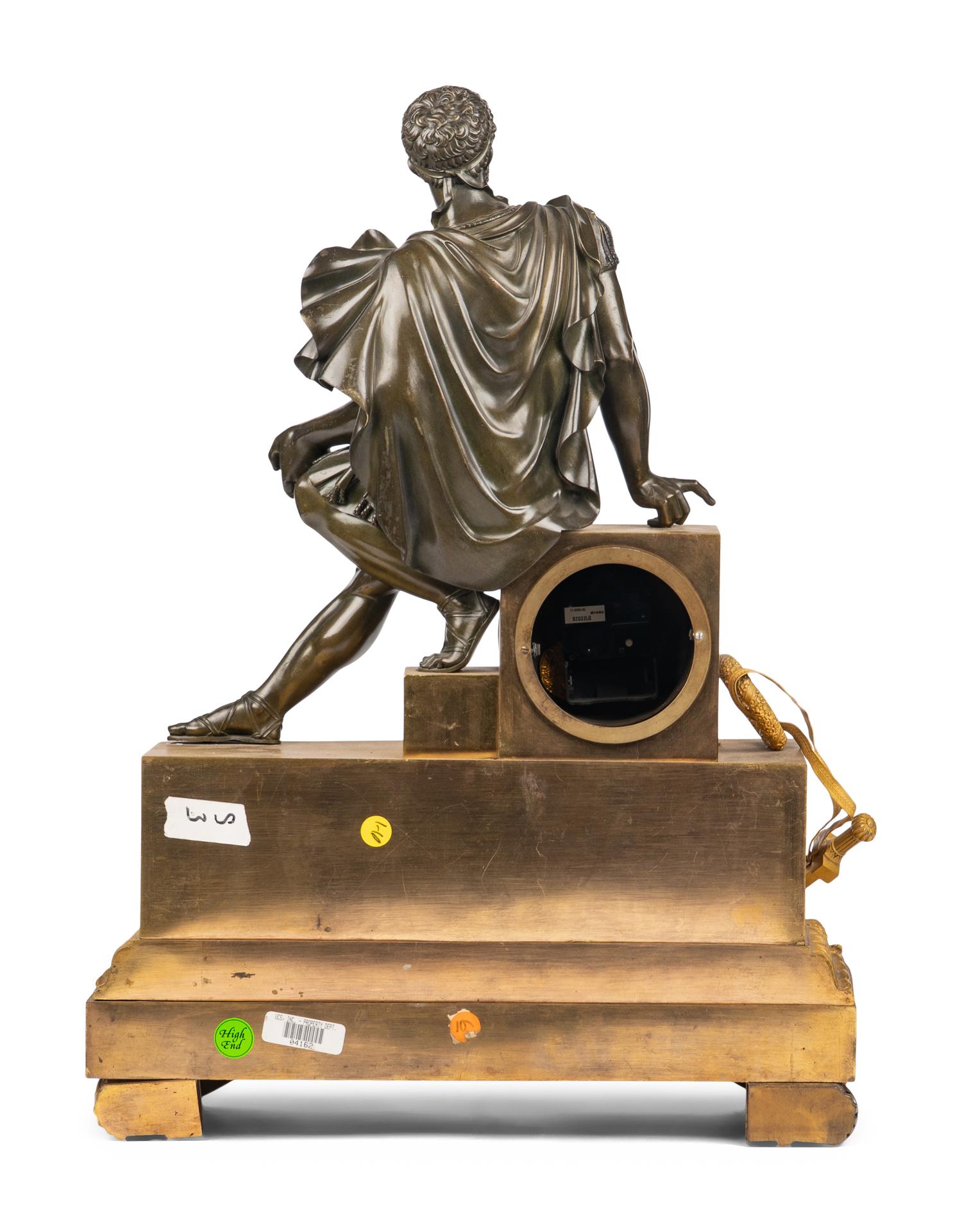 An Empire Gilt and Patinated Bronze Figural Mantel Clock