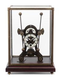 A Continental Cased Brass Skeleton Clock
