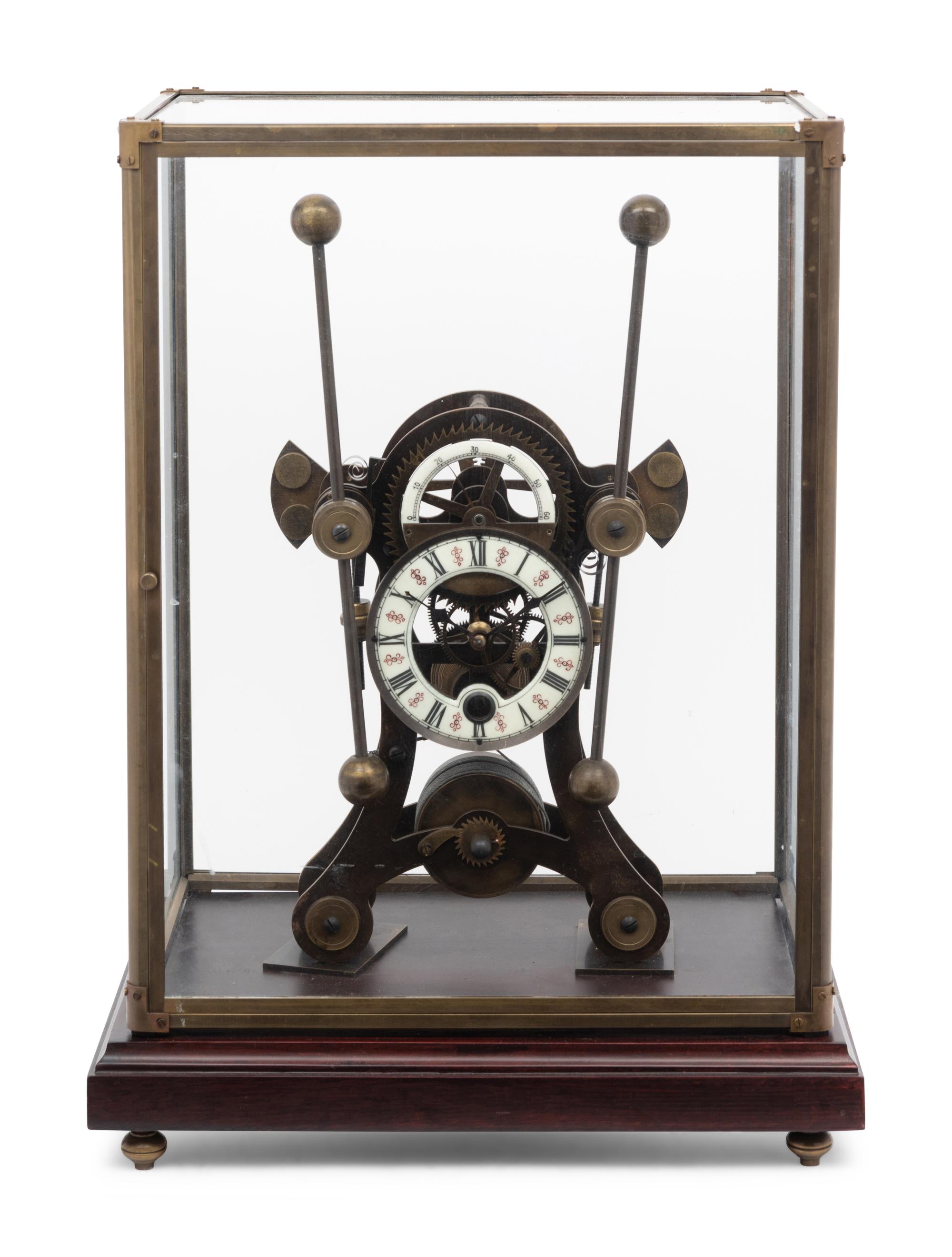 A Continental Cased Brass Skeleton Clock