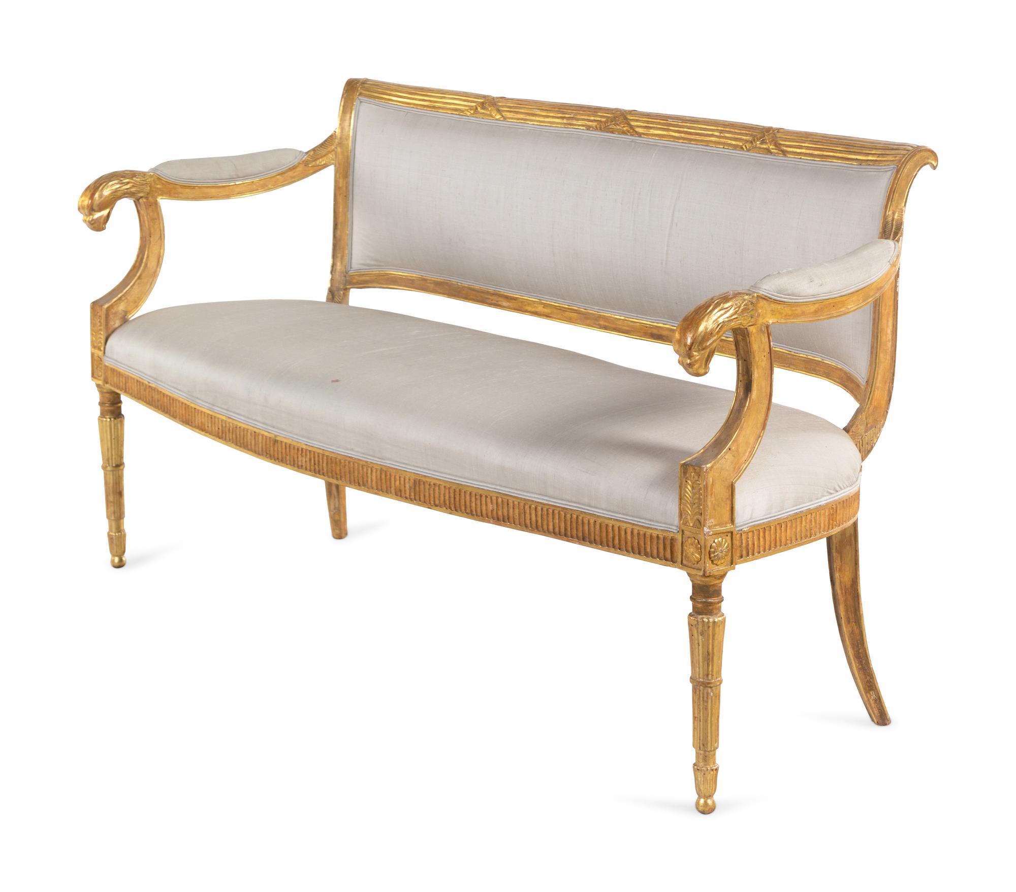 A Pair of Northern Italian Giltwood Sofas with Griffin Supports