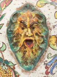 An Italian Majolica Covered Urn with Lion Mask Handles