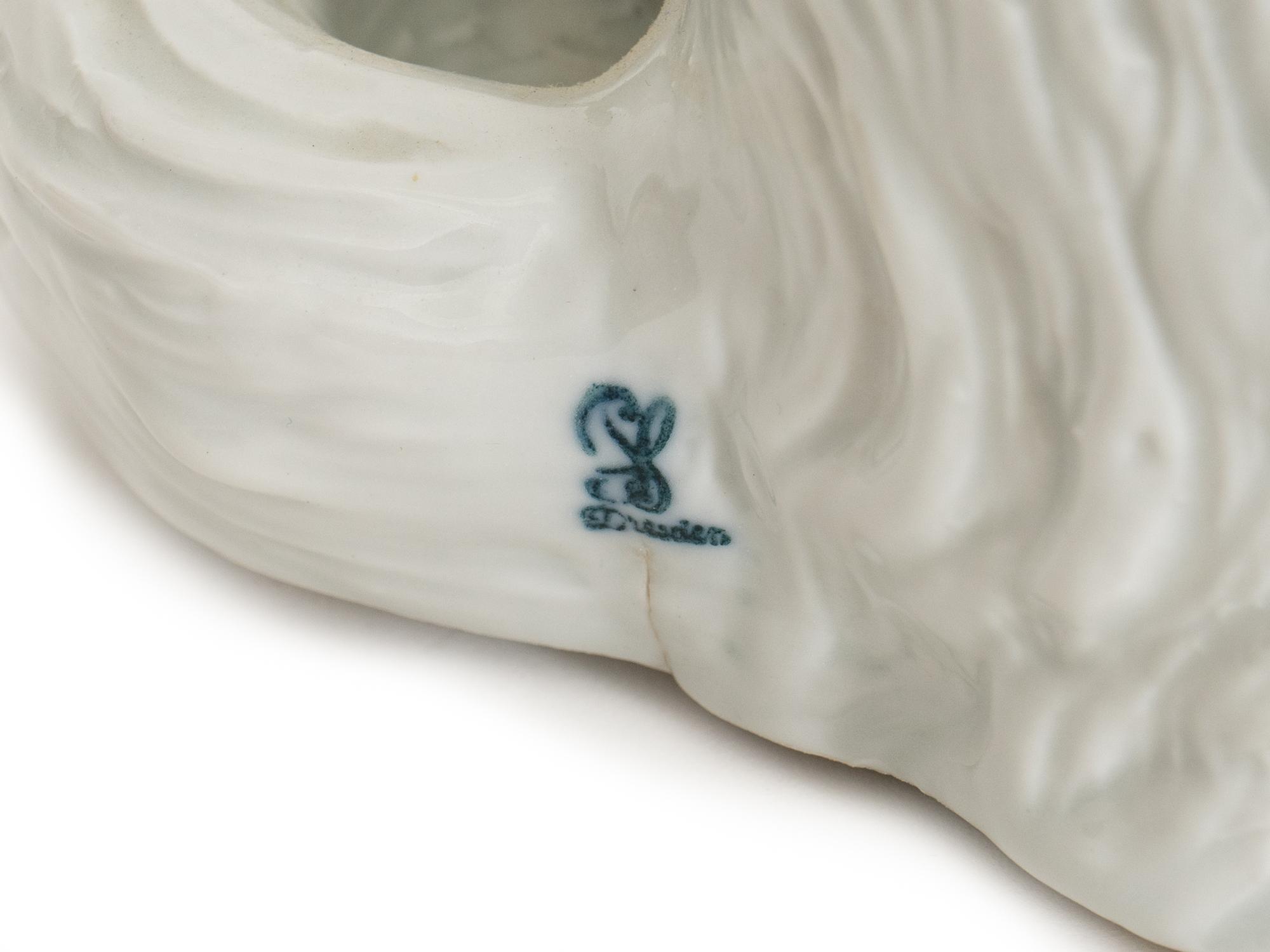 A Dresden Porcelain Bolognese Dog Figure