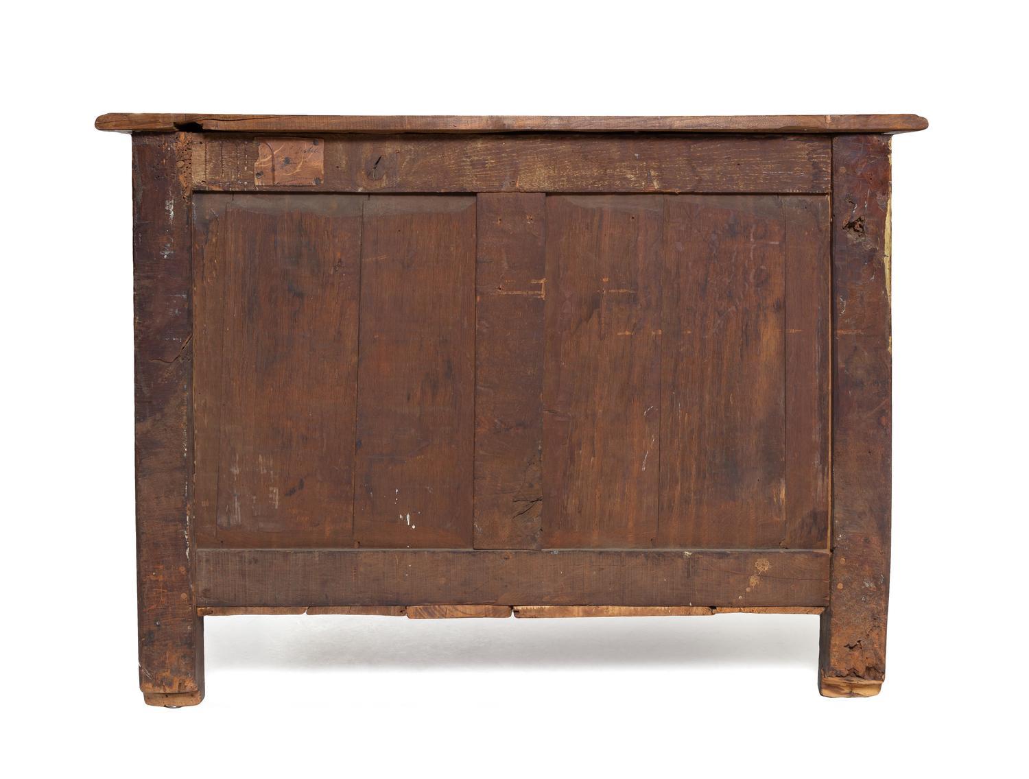 A Régence Gilt Metal Mounted Carved Walnut Serpentine Commode