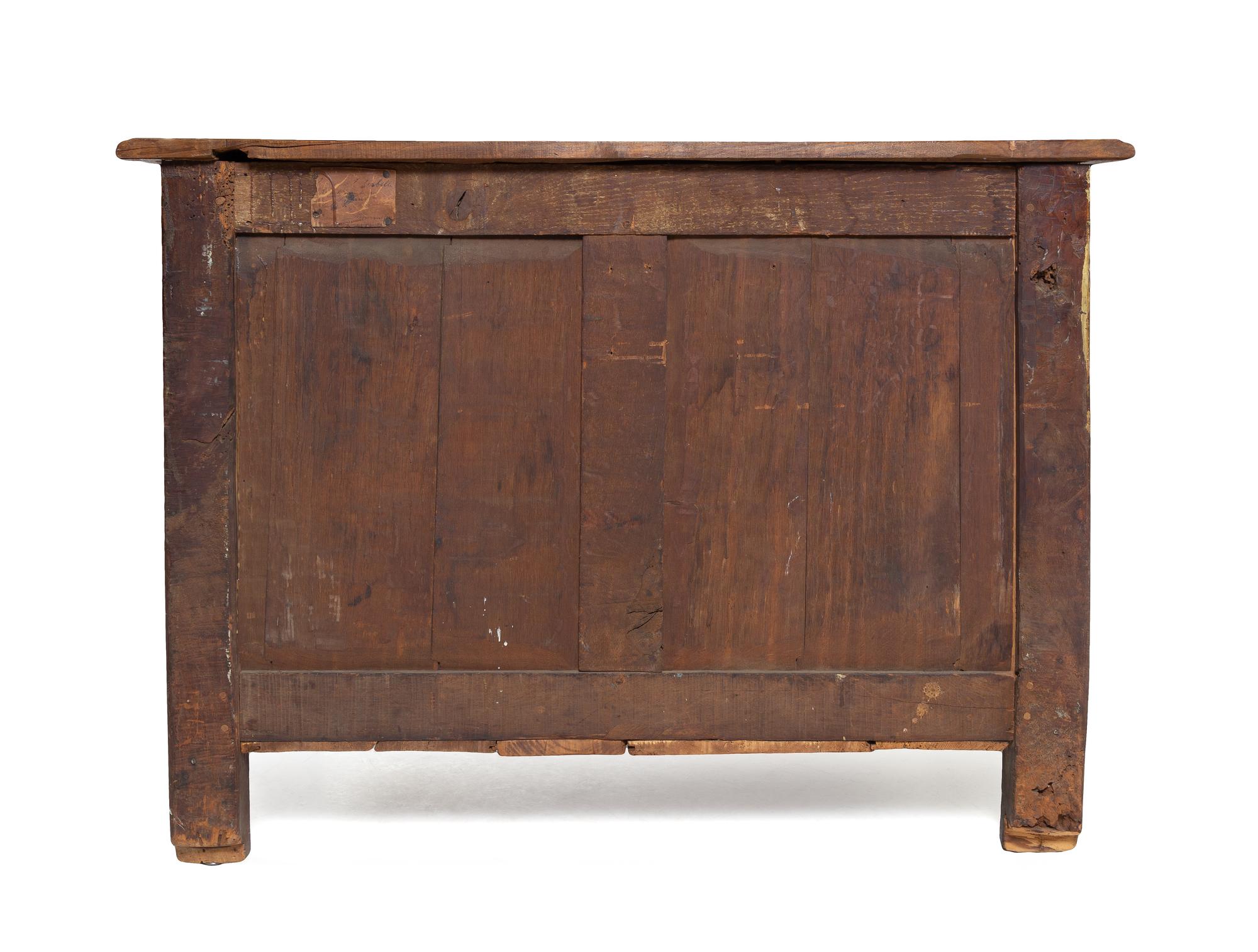 A Régence Gilt Metal Mounted Carved Walnut Serpentine Commode