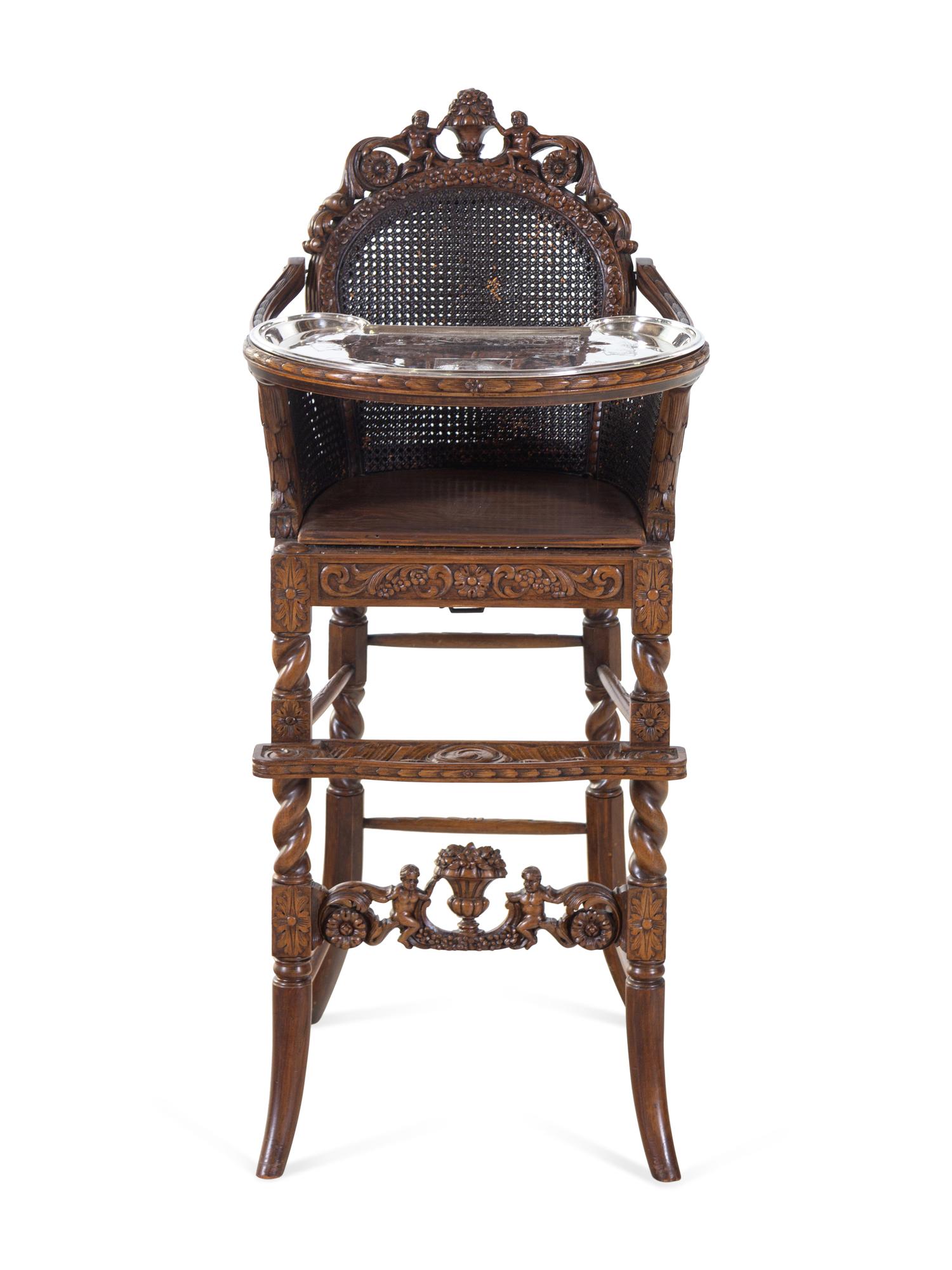 A Rococo Revival Carved Wood High Chair with a Fitted American Silver-Plate Tray
