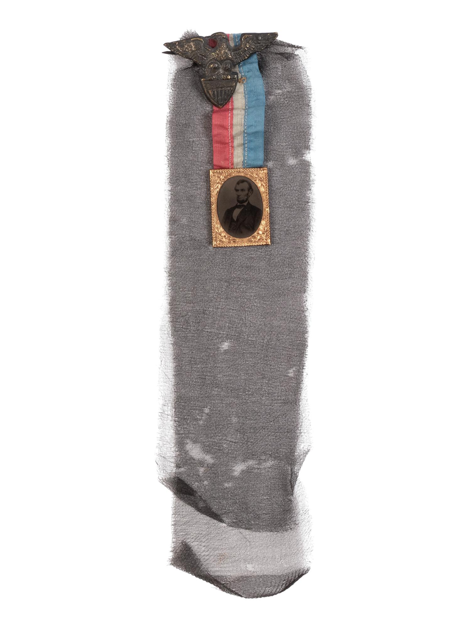 [LINCOLN'S FUNERAL]. A mourning badge with ferrotype image of Abraham Lincoln, ca. 19 April 1865.