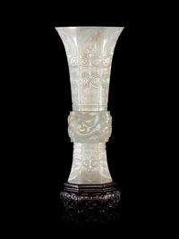 A Carved White Jade Gu Vase