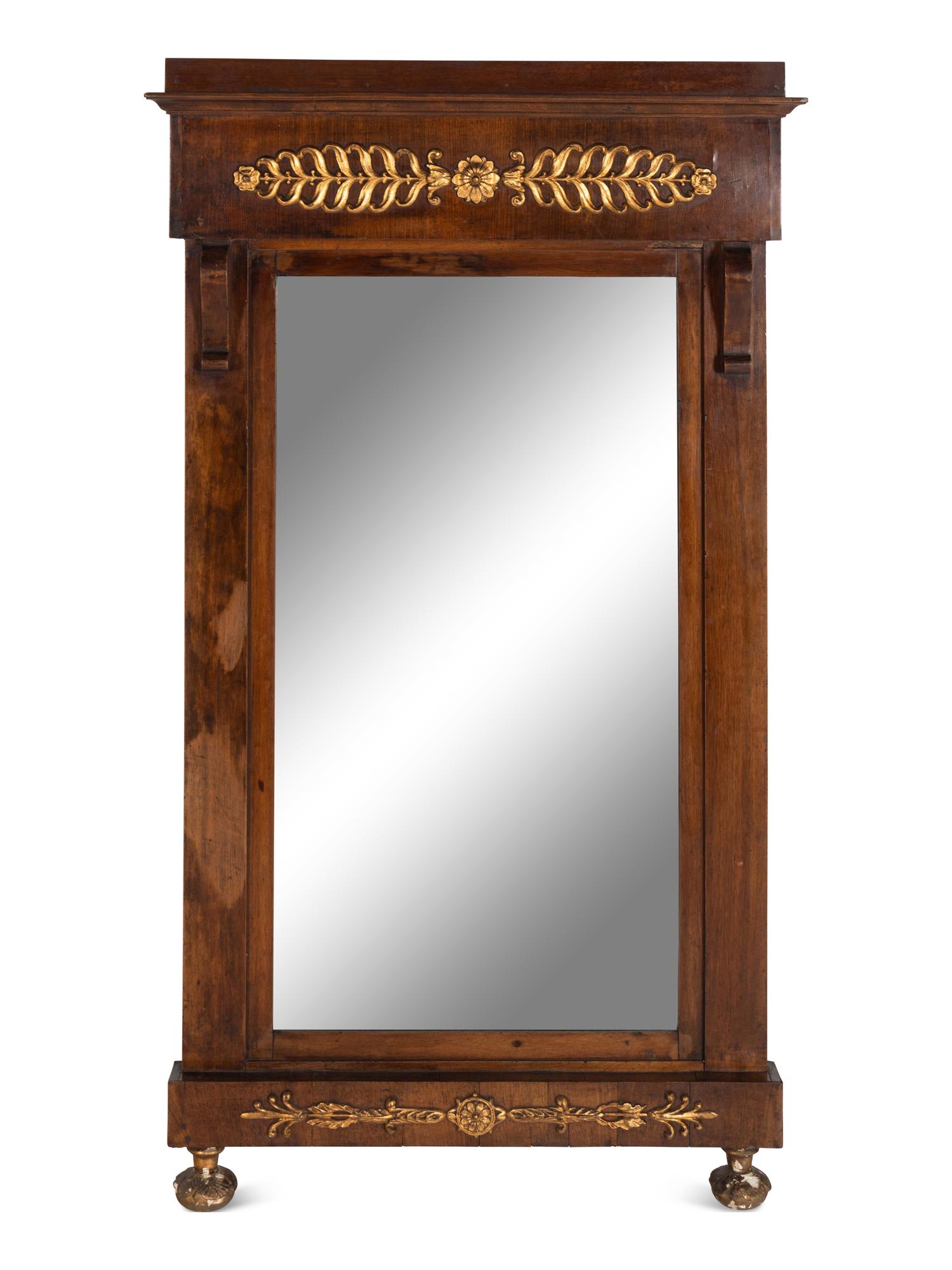 An Empire Walnut and Parcel Gilt Mirror