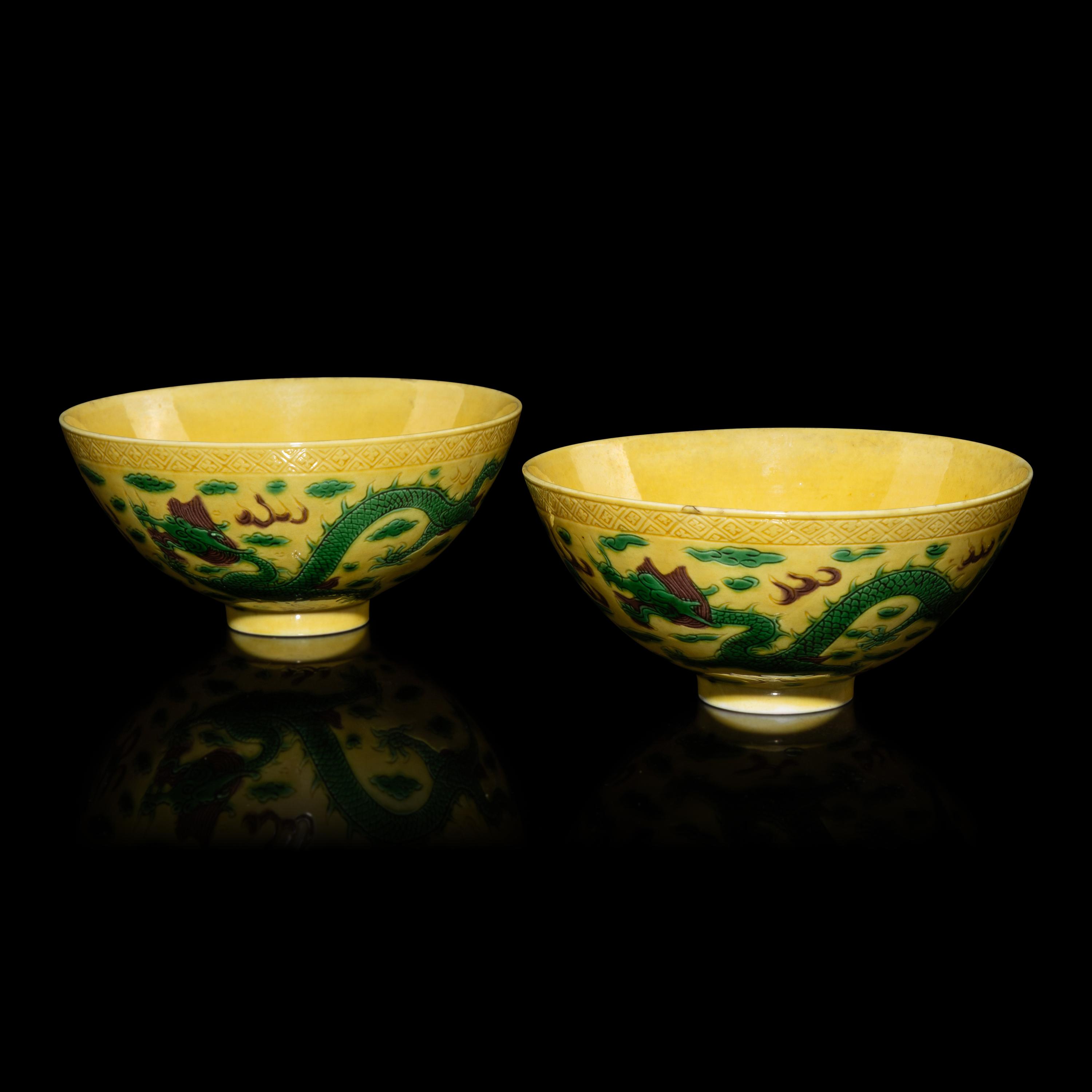 A Pair of Chinese Yellow-Ground Green and Aubergine-Enameled Porcelain 'Dragon' Bowls — 黃地素三彩龍紋碗一對