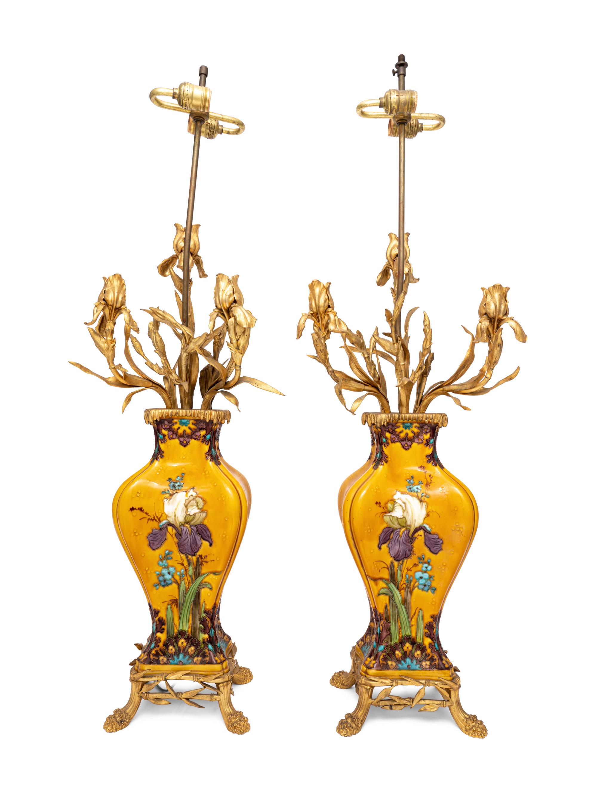 A Pair of Continental Gilt Metal Mounted Polychrome Glazed Porcelain Lamps