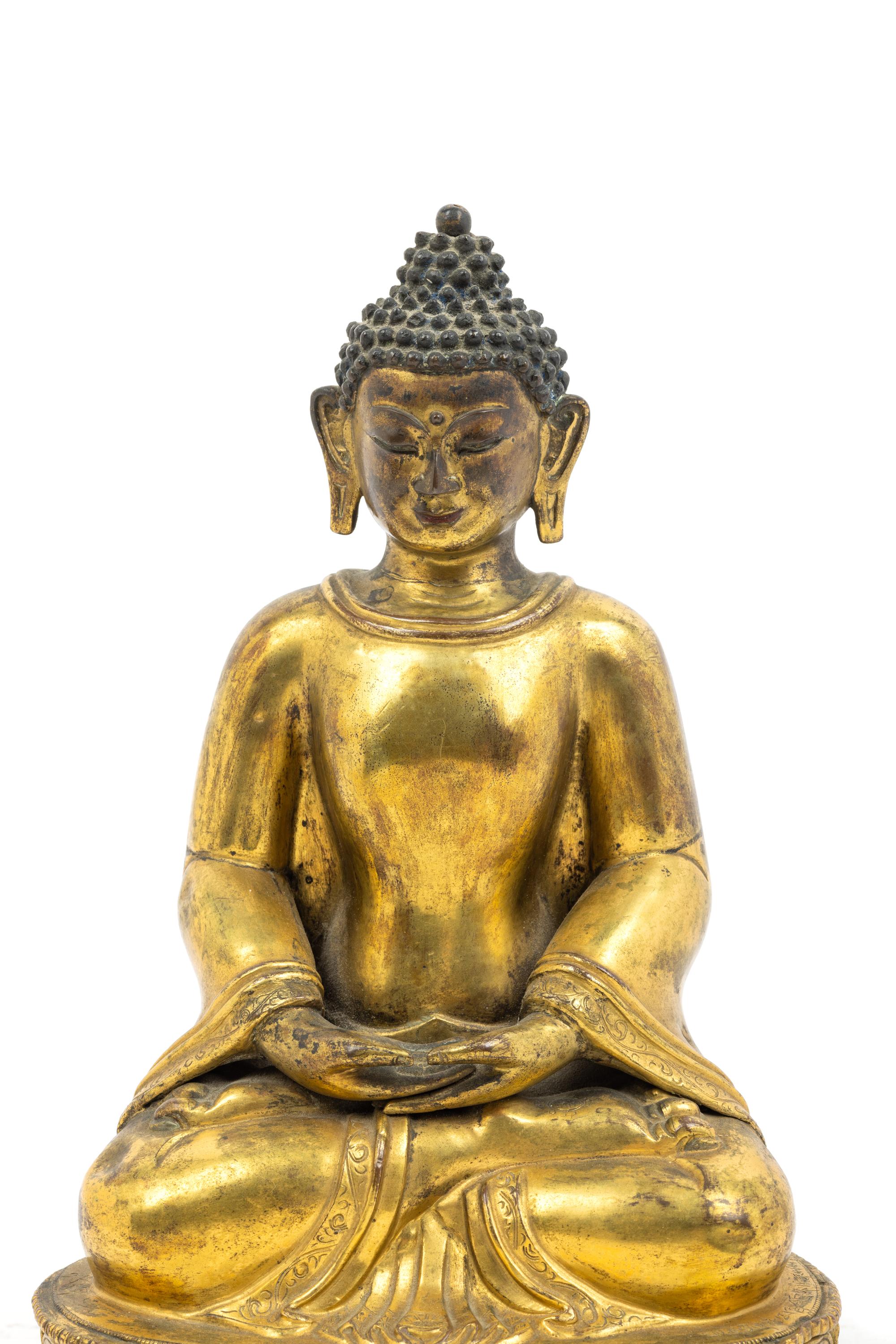 A Large Tibetan Gilt Bronze Figure of Seated Buddha