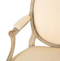 A Set of Four Louis XVI Grey-Painted and Parcel Gilt Fauteuils