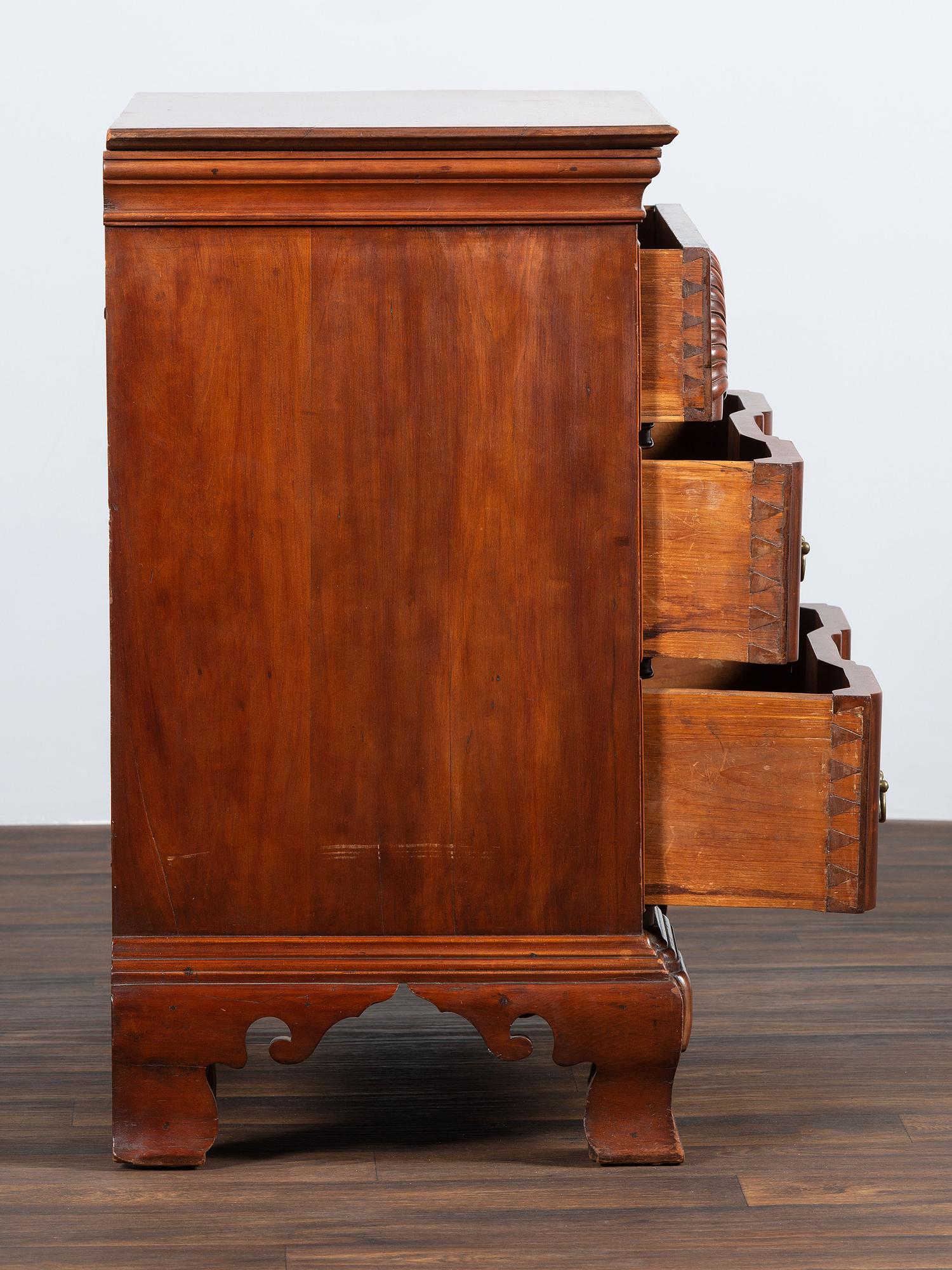 A Chippendale Shell-and-Block Carved Cherrywood Chest of Drawers