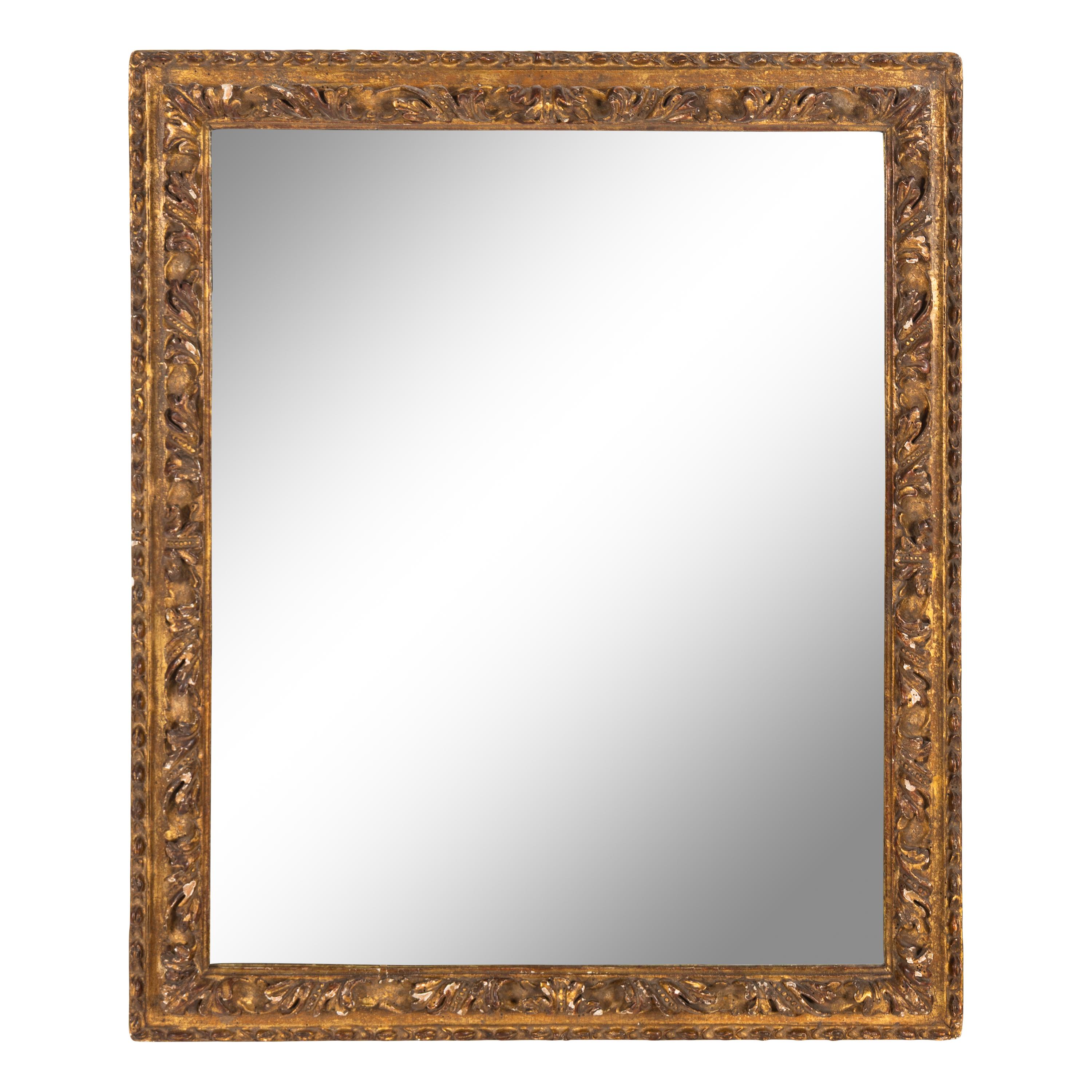 A Continental Carved Giltwood Mirror