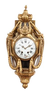 A Louis XVI Gilt Bronze Cartel Clock Height 28 inches. — LATE 18TH CENTURY