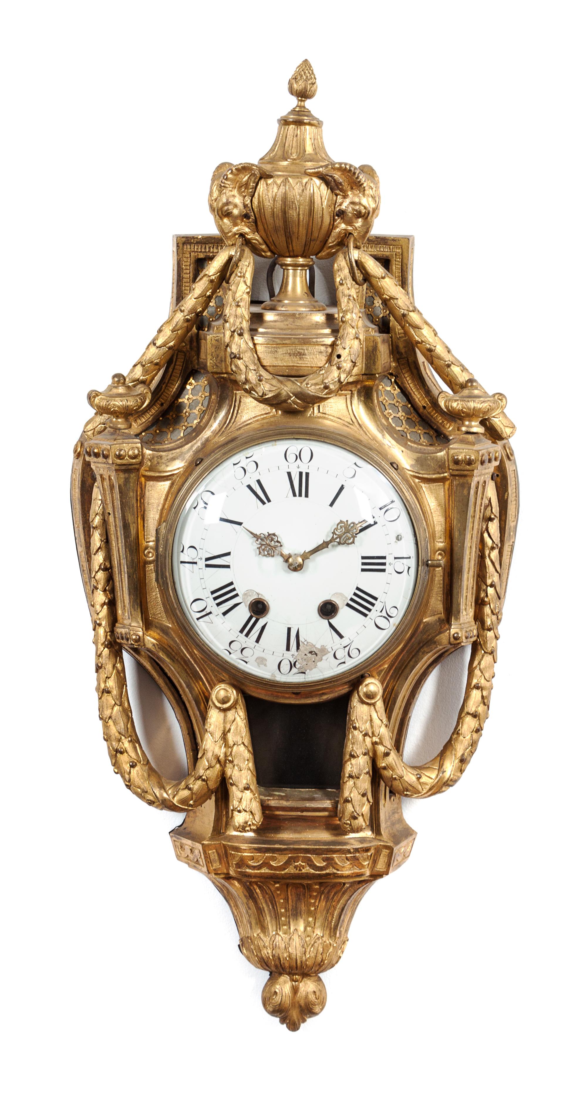 A Louis XVI Gilt Bronze Cartel Clock Height 28 inches. — LATE 18TH CENTURY