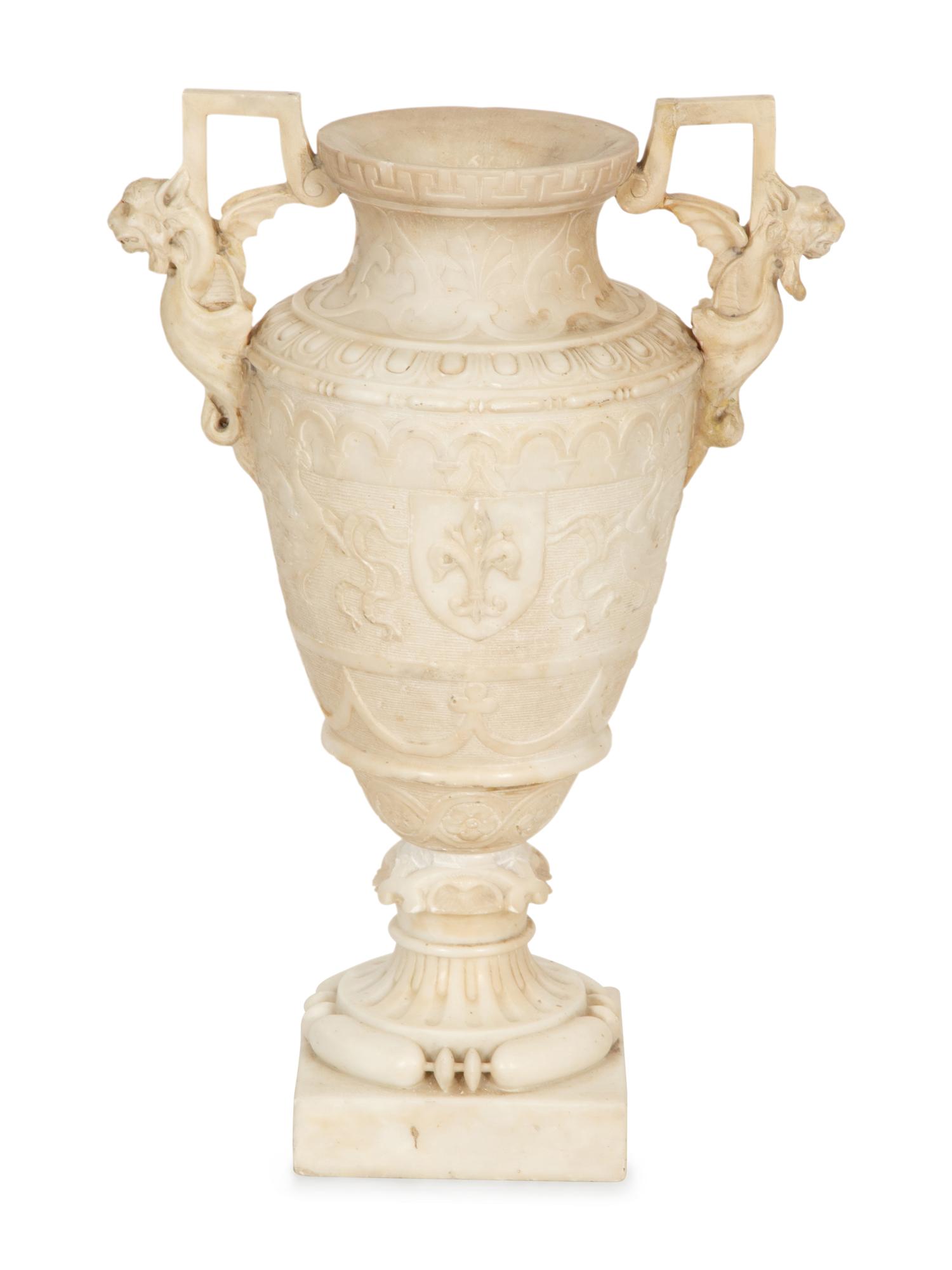 An Italian Carved Marble Urn with Griffin Handles
