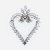 A platinum and diamond pendant/brooch