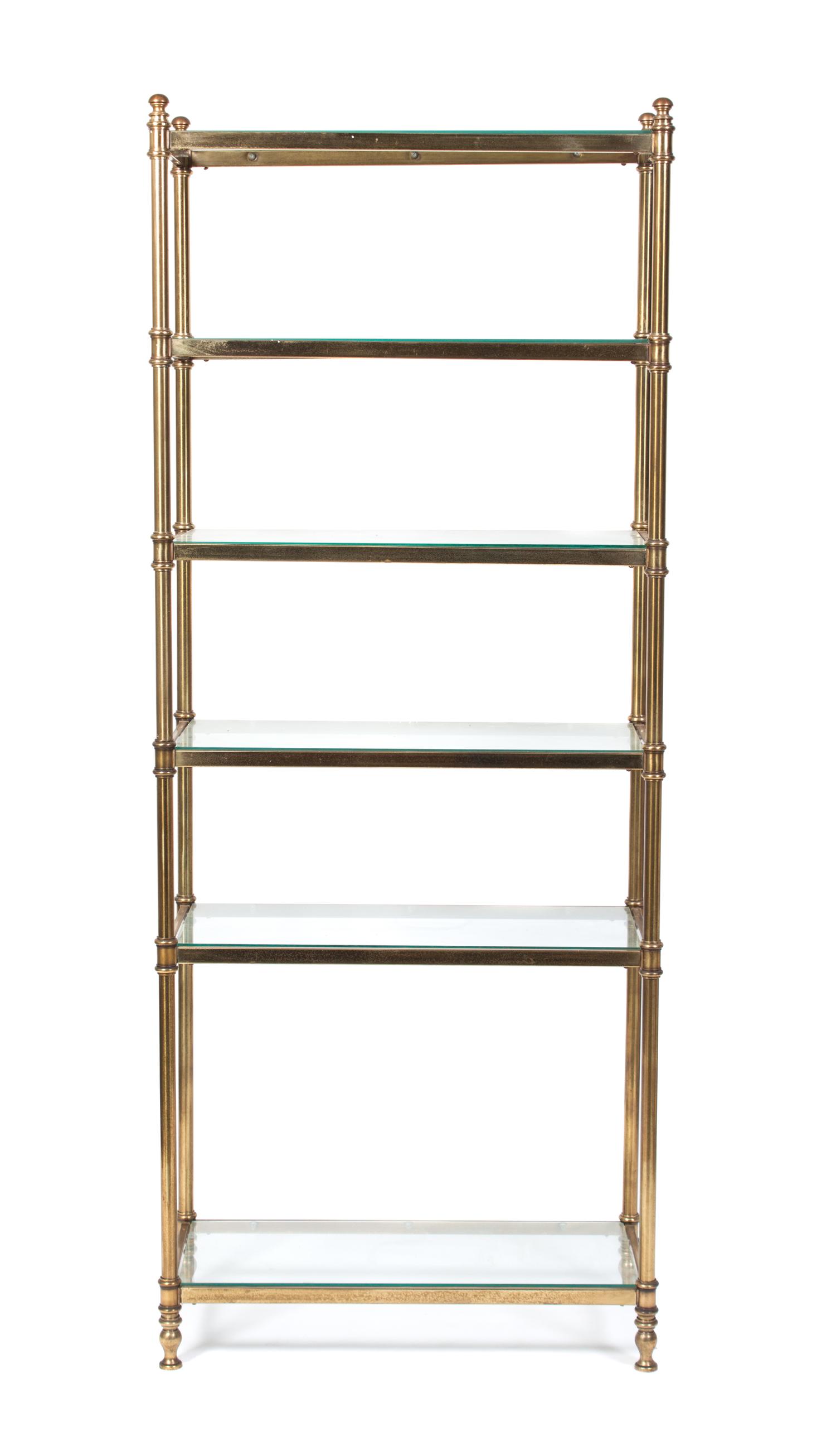 A Neoclassical Style Brass Etagere Height 75 x width 30 x depth 13 3/4 inches.