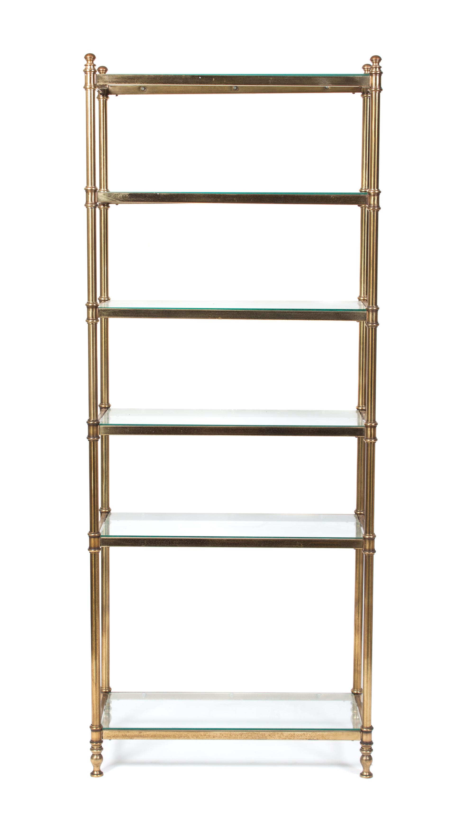 A Neoclassical Style Brass Etagere Height 75 x width 30 x depth 13 3/4 inches.