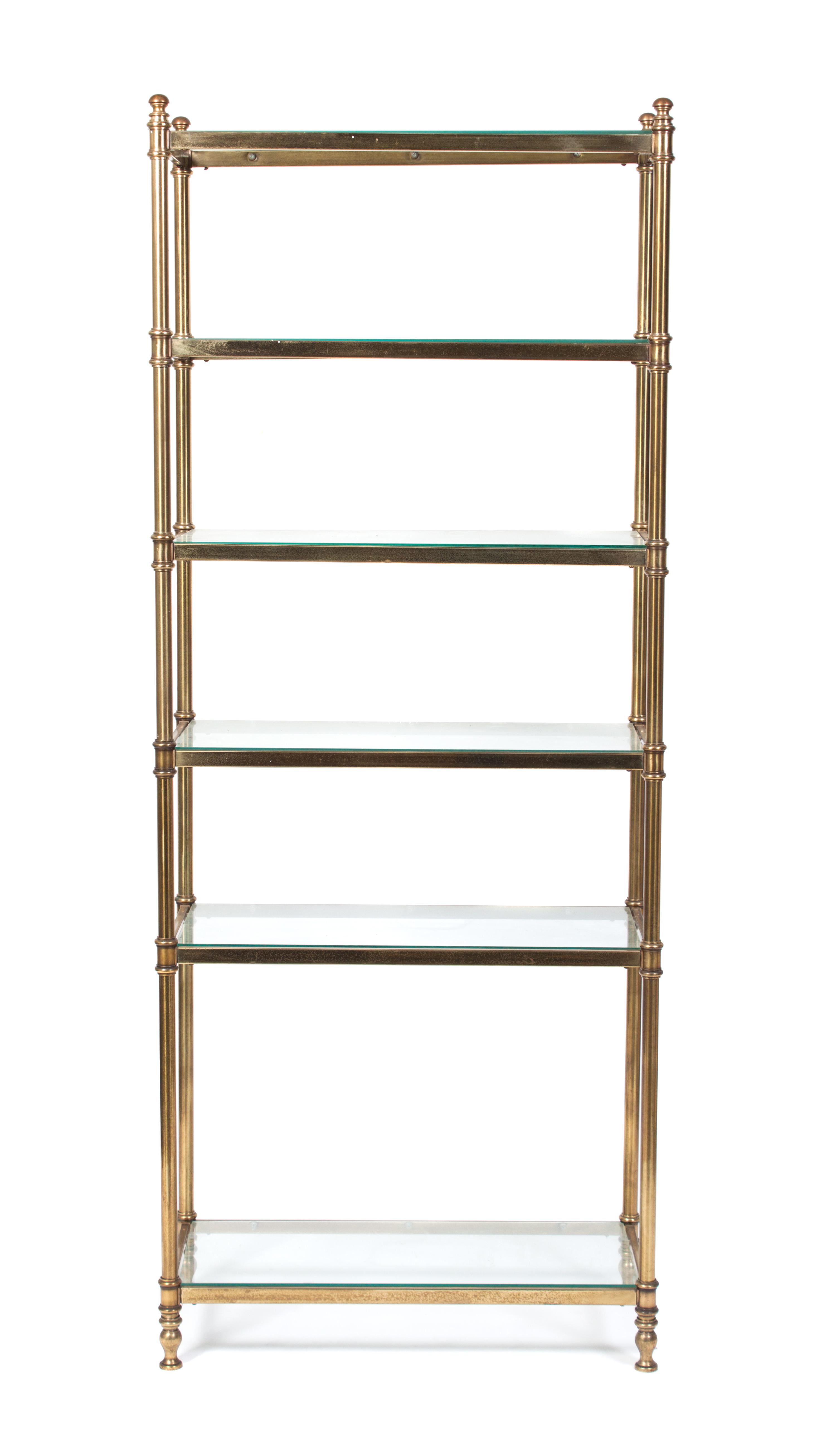 A Neoclassical Style Brass Etagere Height 75 x width 30 x depth 13 3/4 inches.
