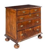 A George II Satinwood-Inlaid Walnut Chest of Drawers