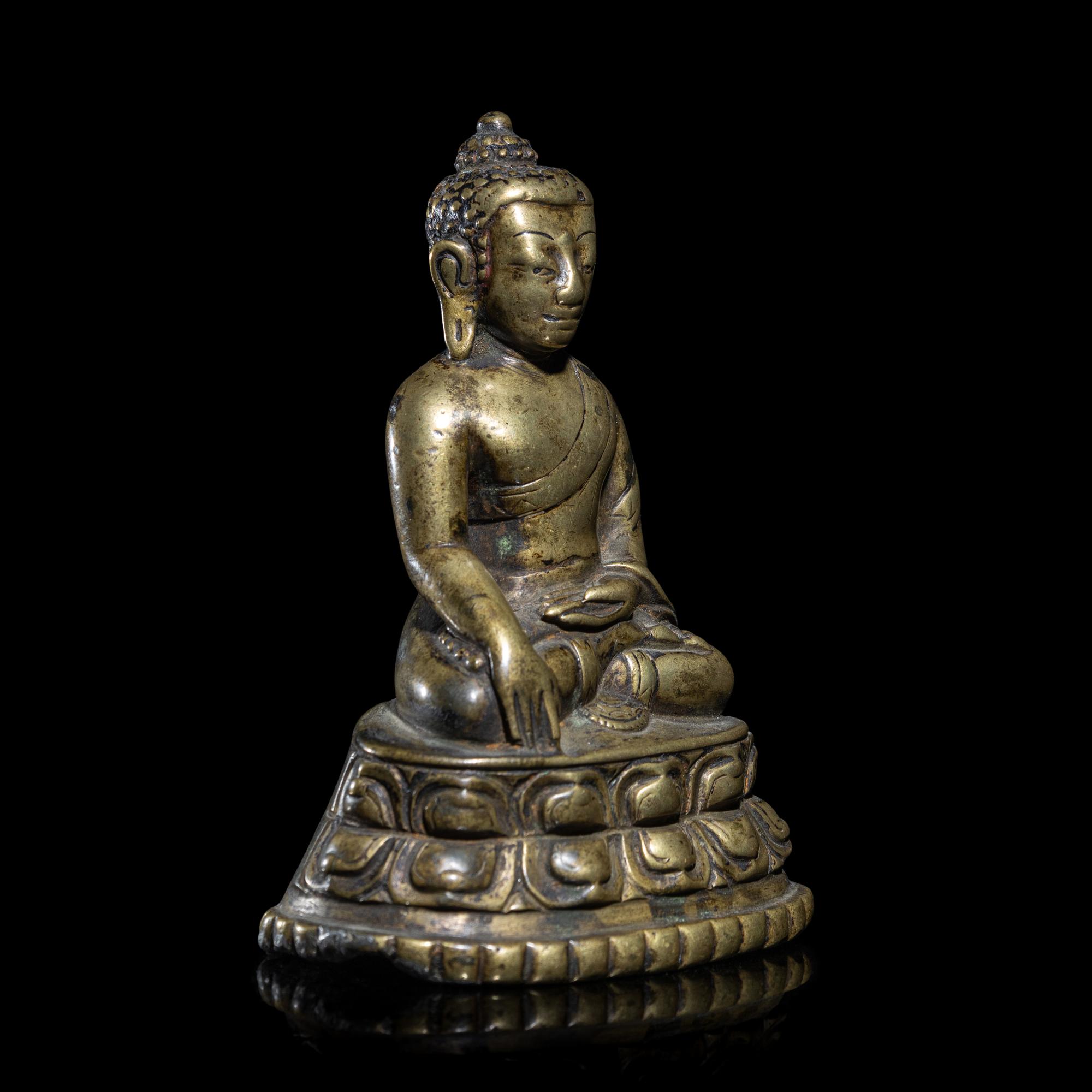 A Tibetan Copper Alloy Figure of Buddha Shakyamuni, 14th/15th Century 十四/十五世紀 西藏銅坐佛