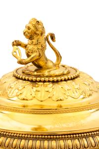 A George III Silver-Gilt Tureen, Benjamin Smith II & Benjamin Smith III, London, 1817, modeled after the Warwick vase, the lid with a l