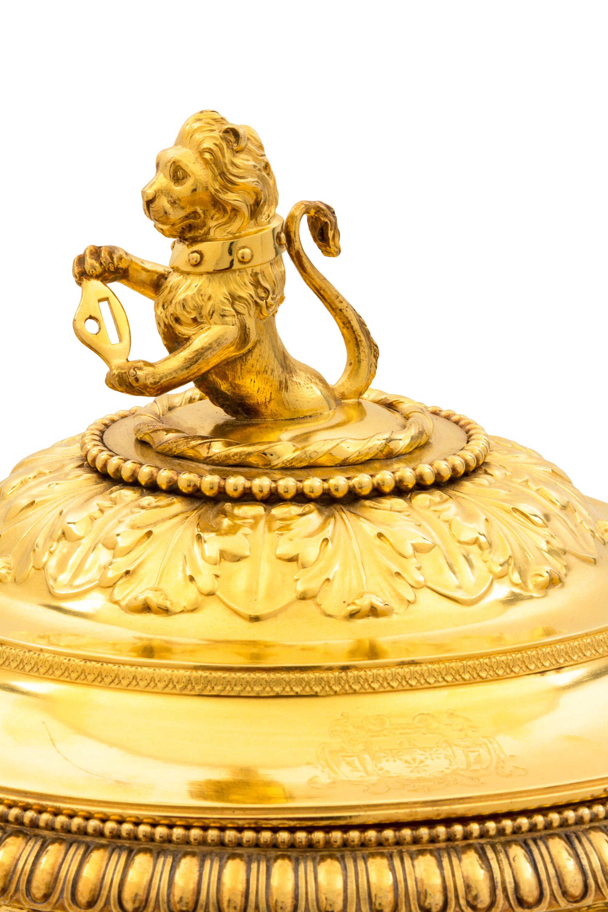 A George III Silver-Gilt Tureen, Benjamin Smith II & Benjamin Smith III, London, 1817, modeled after the Warwick vase, the lid with a l