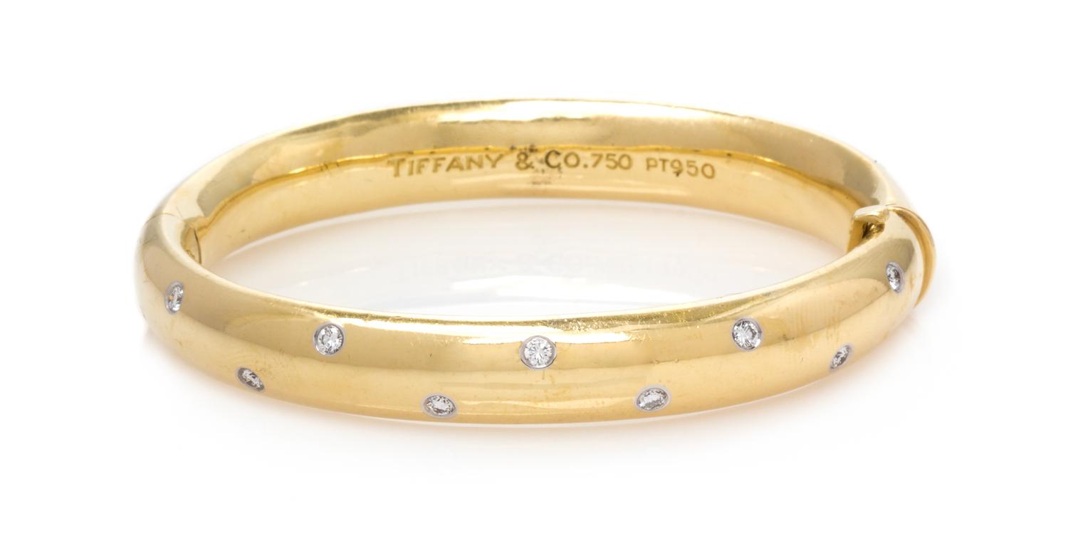 An 18 Karat Yellow Gold, Platinum and Diamond 'Etoile' Bangle Bracelet, Tiffany & Co., 28.80 dwts.