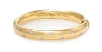 An 18 Karat Yellow Gold, Platinum and Diamond 'Etoile' Bangle Bracelet, Tiffany & Co., 28.80 dwts.