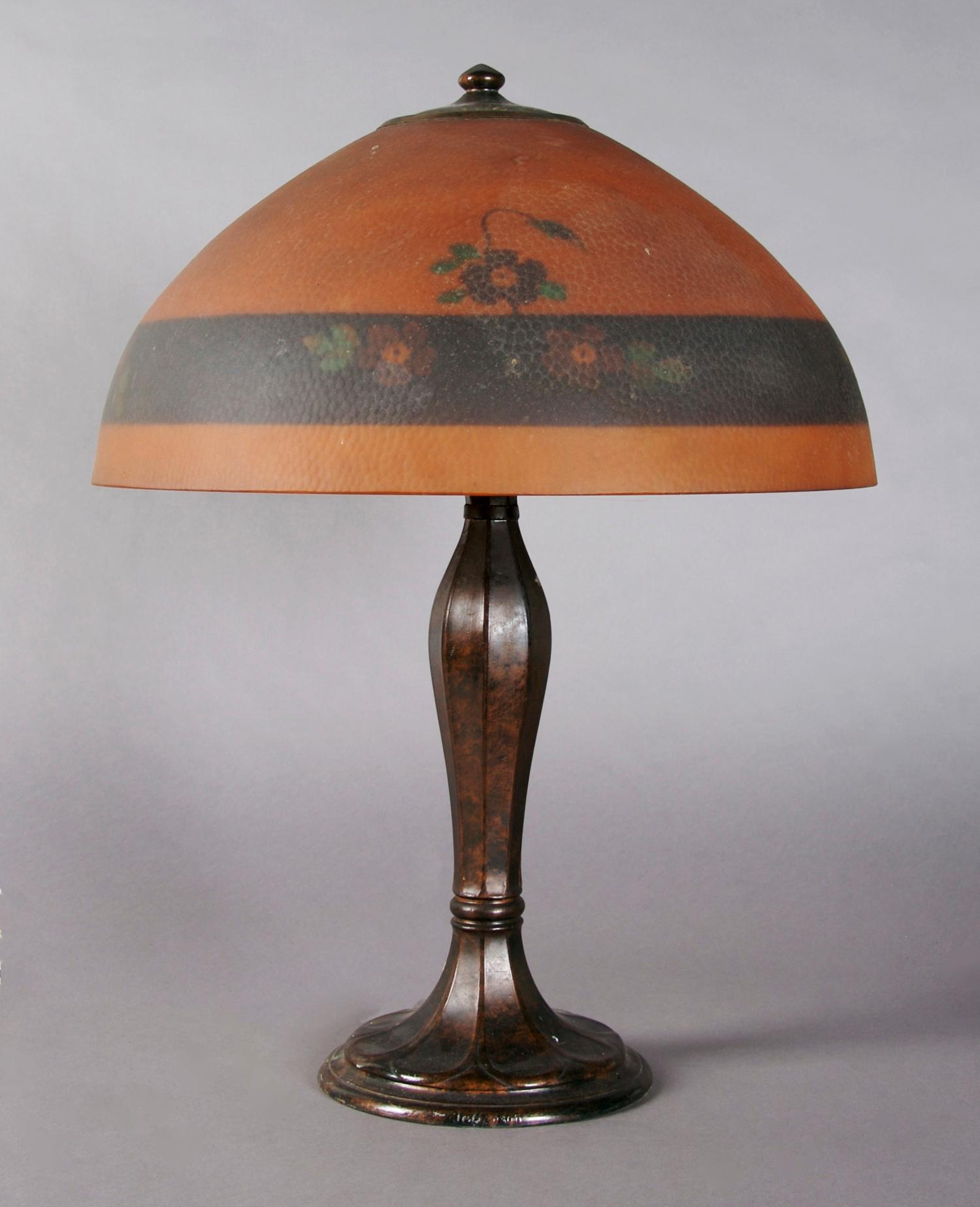 An American Reverse Painted Lamp, Jefferson, Diameter of shade 16 inches; height of lamp overall 21 1/2 inches.