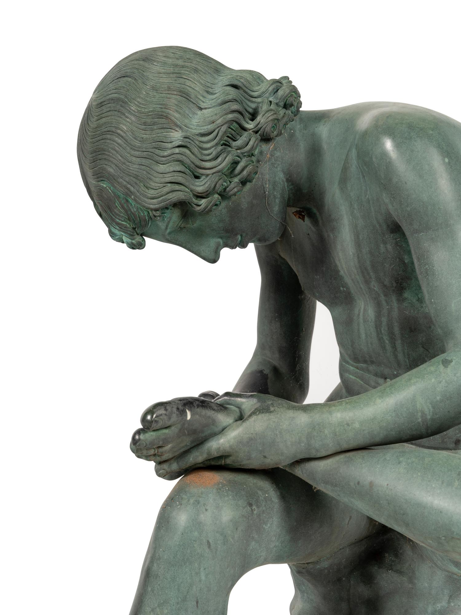 A Patinated Bronze Figure of the Spinario