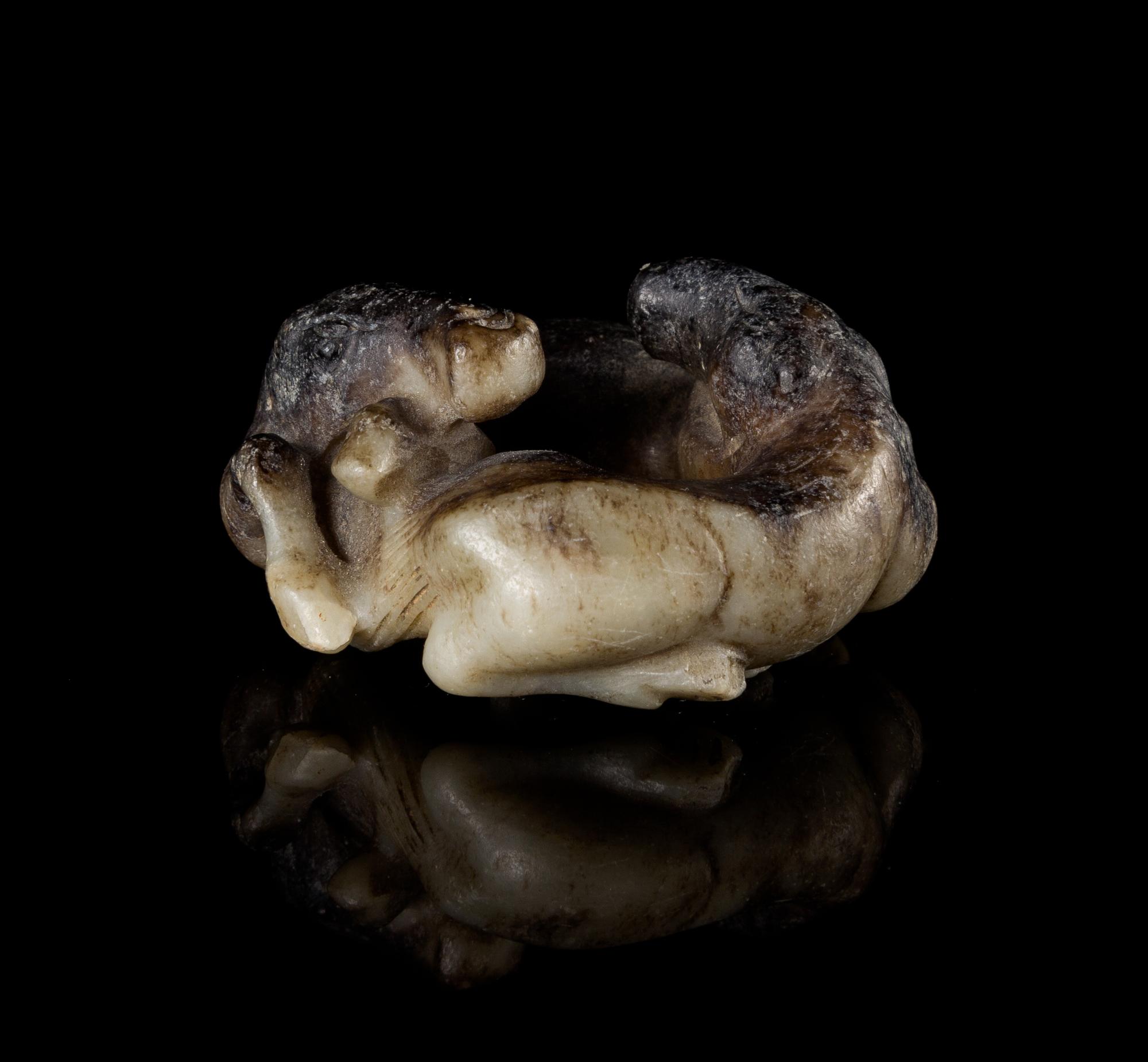 A Small Black and Celadon Jade Figural Group of Two Horses