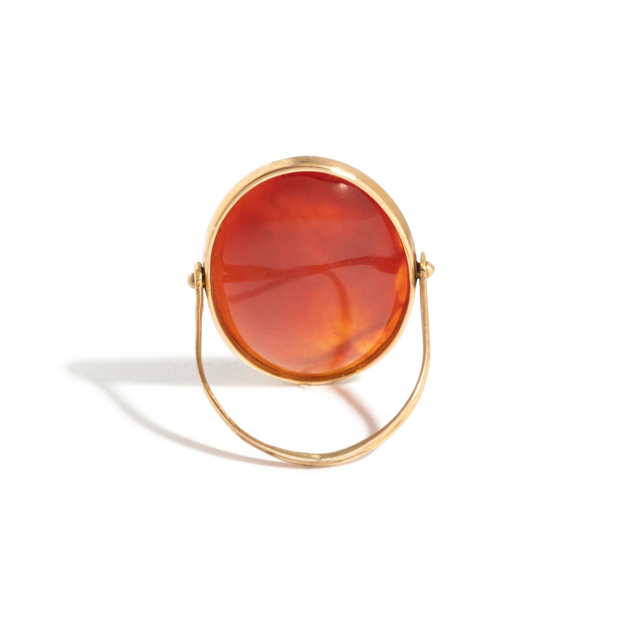 A Neoclassical Gold and Carnelian Swivel Ring with the Princess Leda