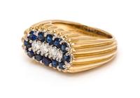 An 18 Karat Yellow Gold, Platinum, Sapphire and Diamond Band, Oscar Heyman Brothers, 10.70 dwts.