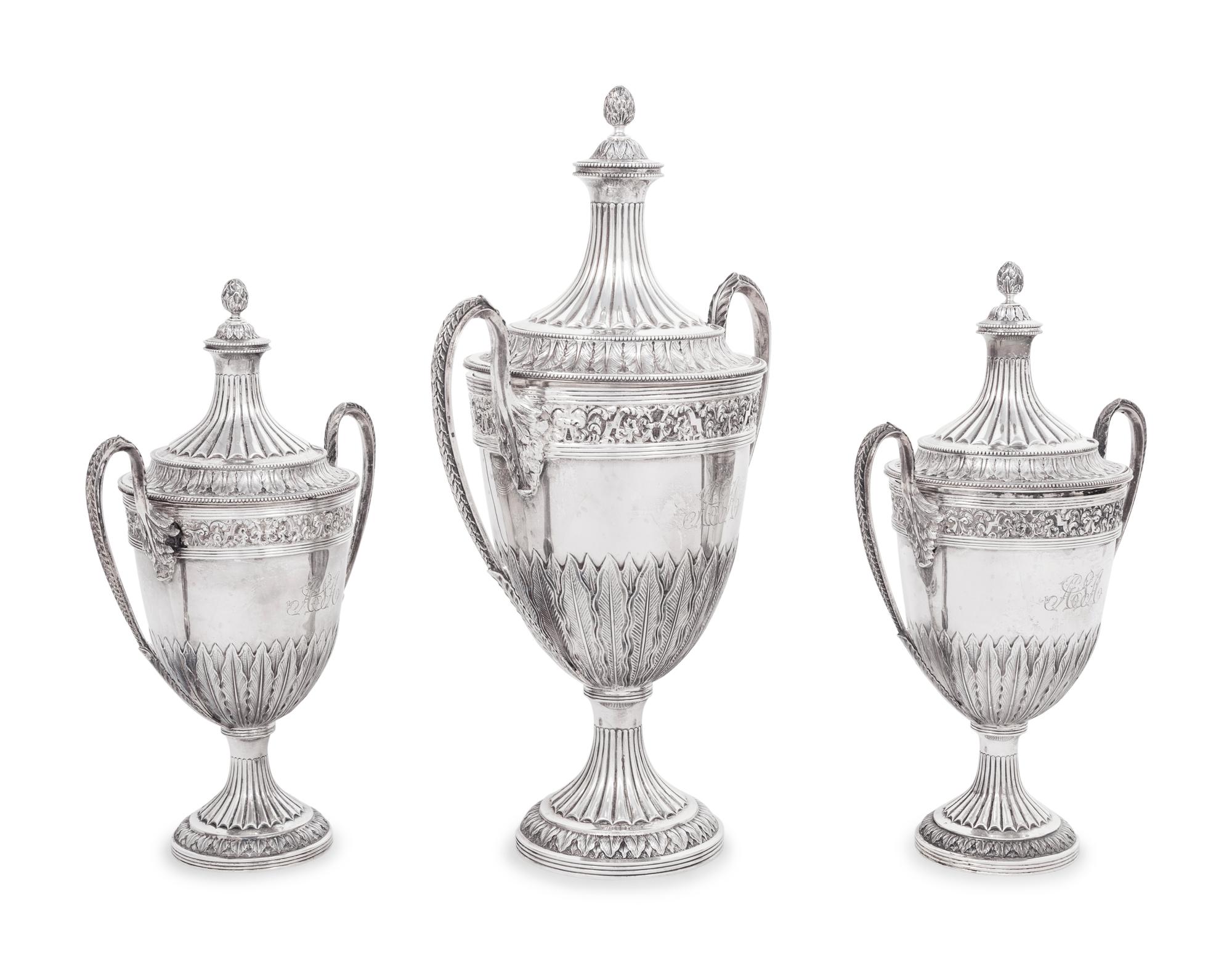 A Set of Three English Silver Covered Urns