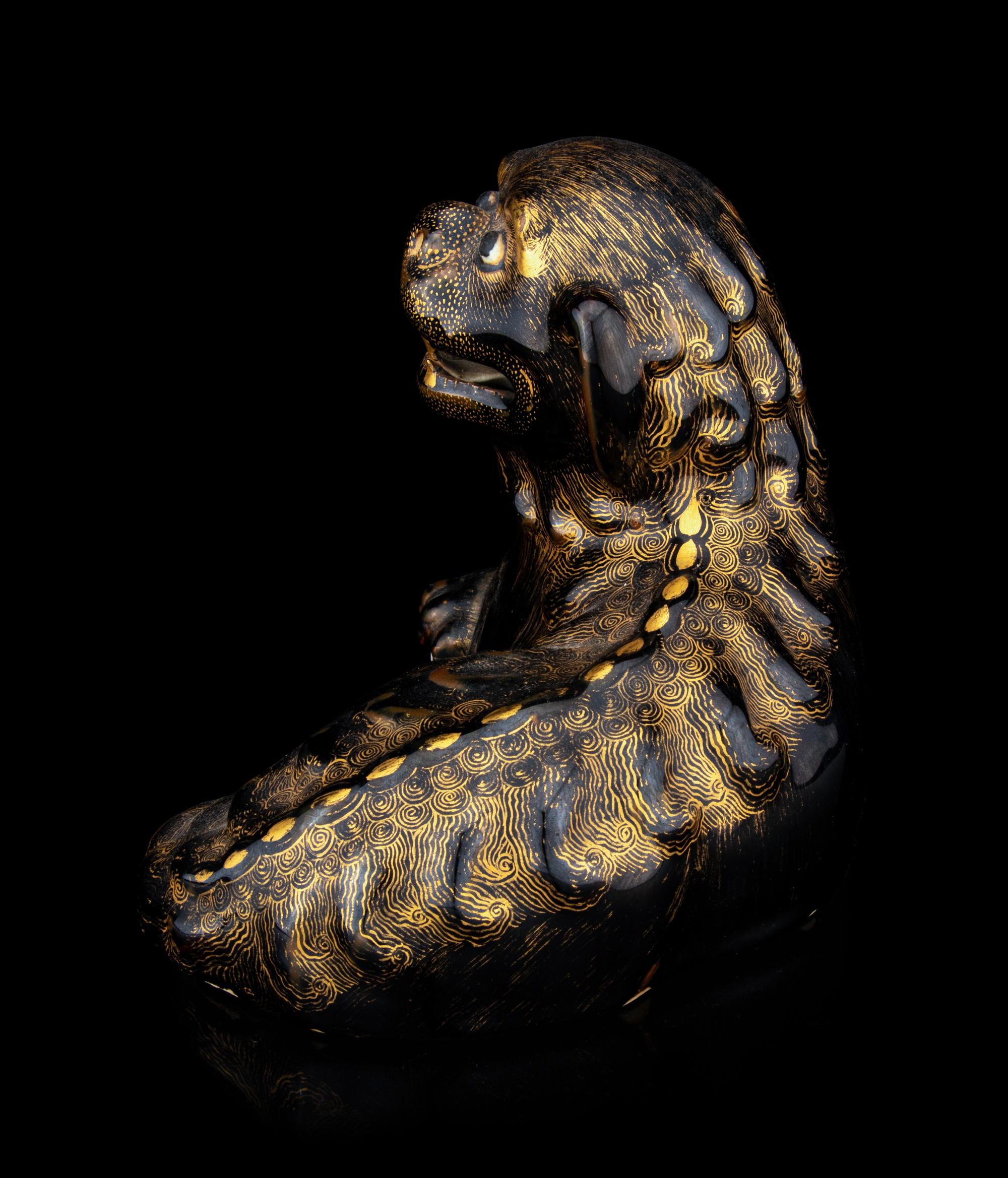 A Chinese Export Gilt Decorated Black Glazed Porcelain Figure of Fu Lion
