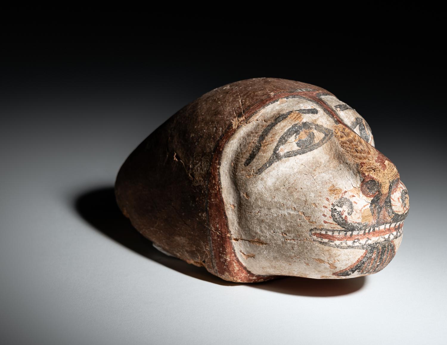 An Egyptian Polychrome Wood Head of a Lion
