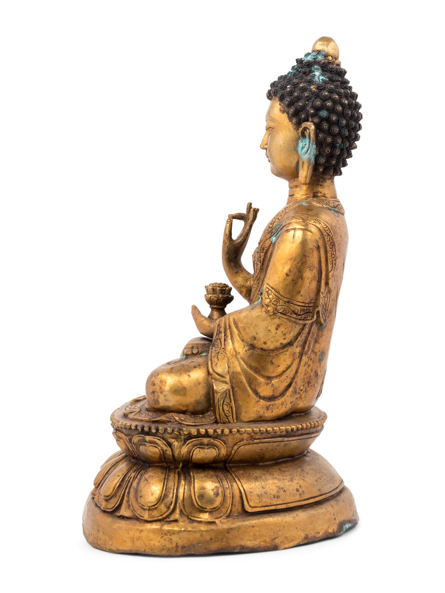 A Gilt Bronze Seated Buddha Figure on Lotus Flower Base