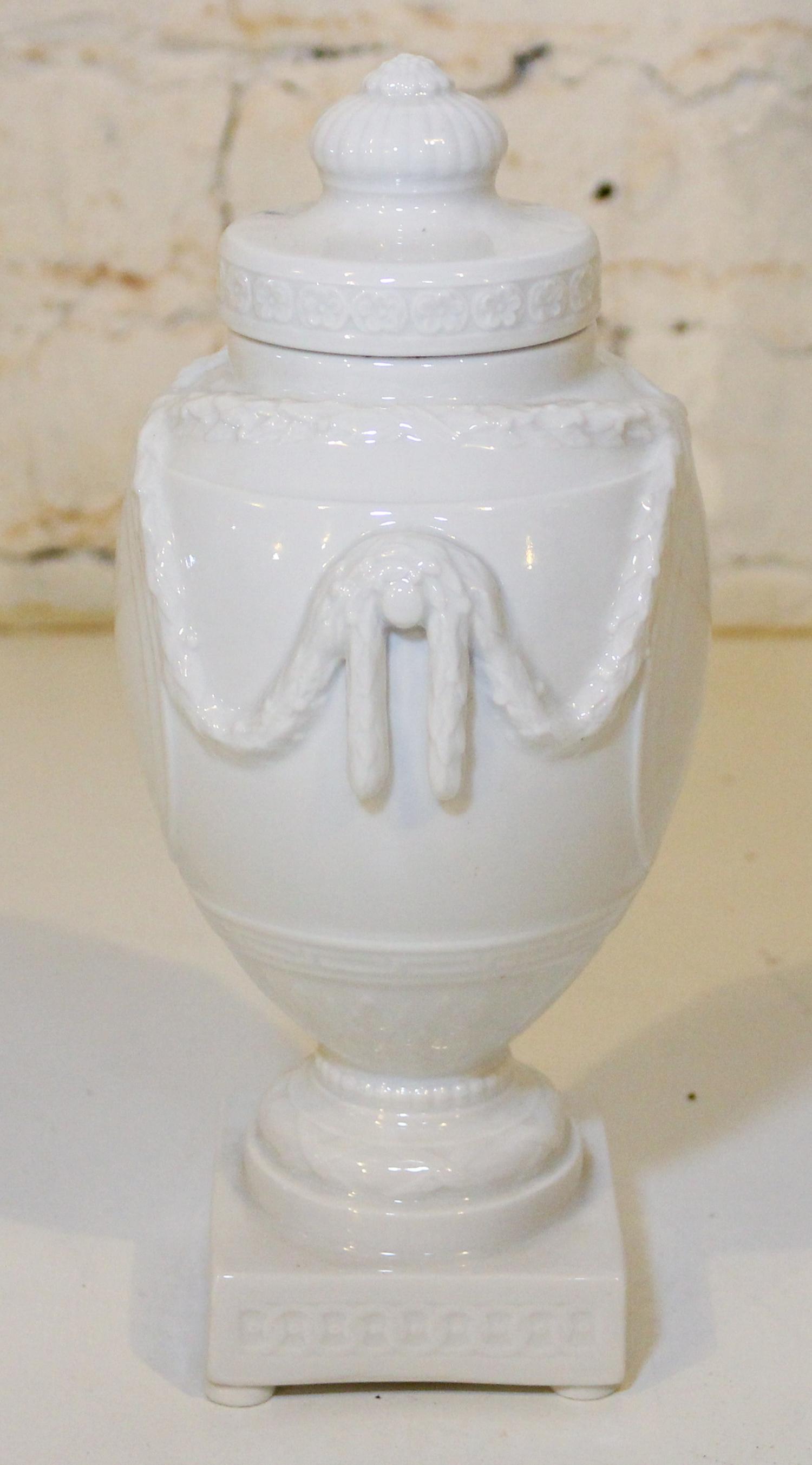 A KPM Blanc de Chine Urn. Height 9 inches.