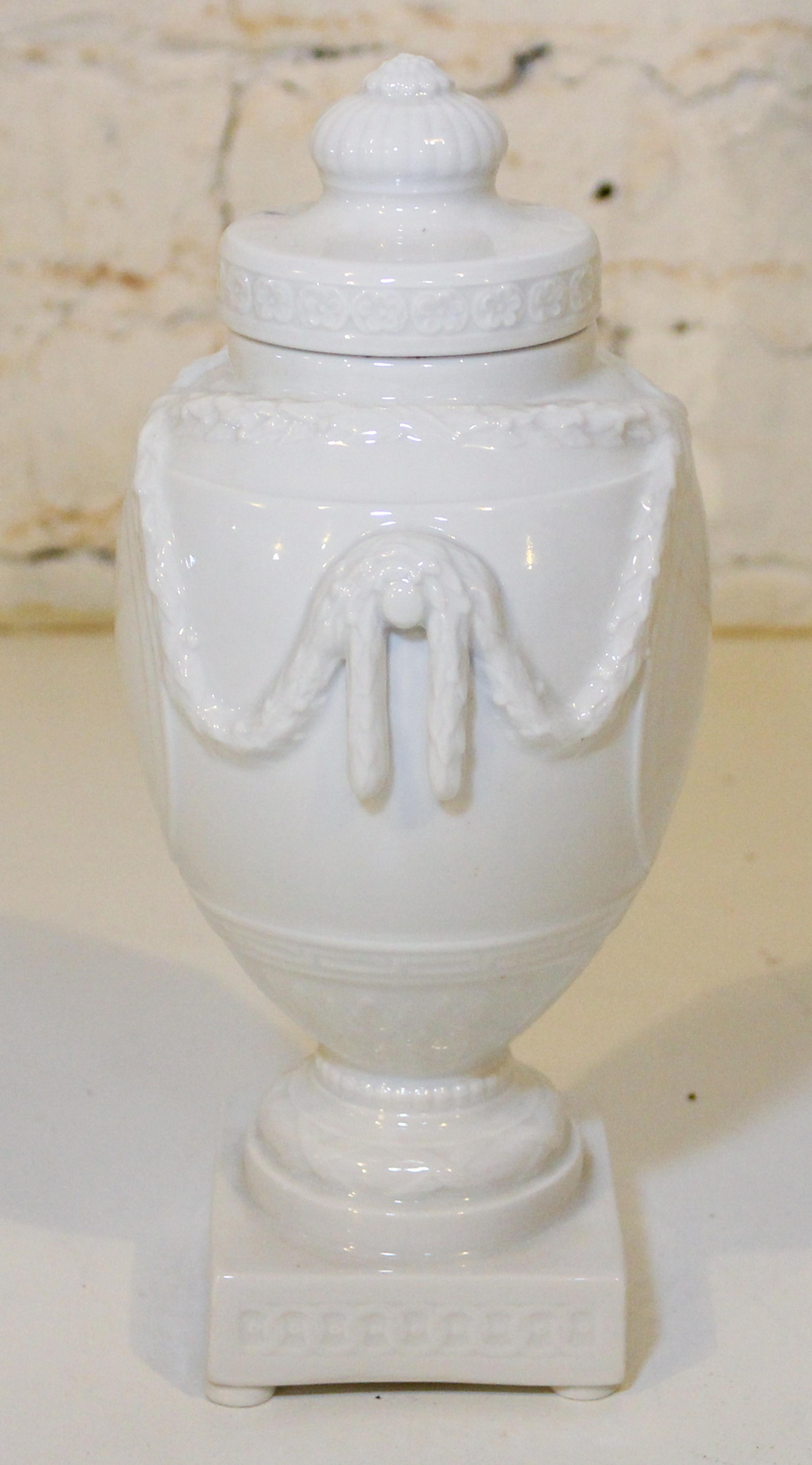 A KPM Blanc de Chine Urn. Height 9 inches.