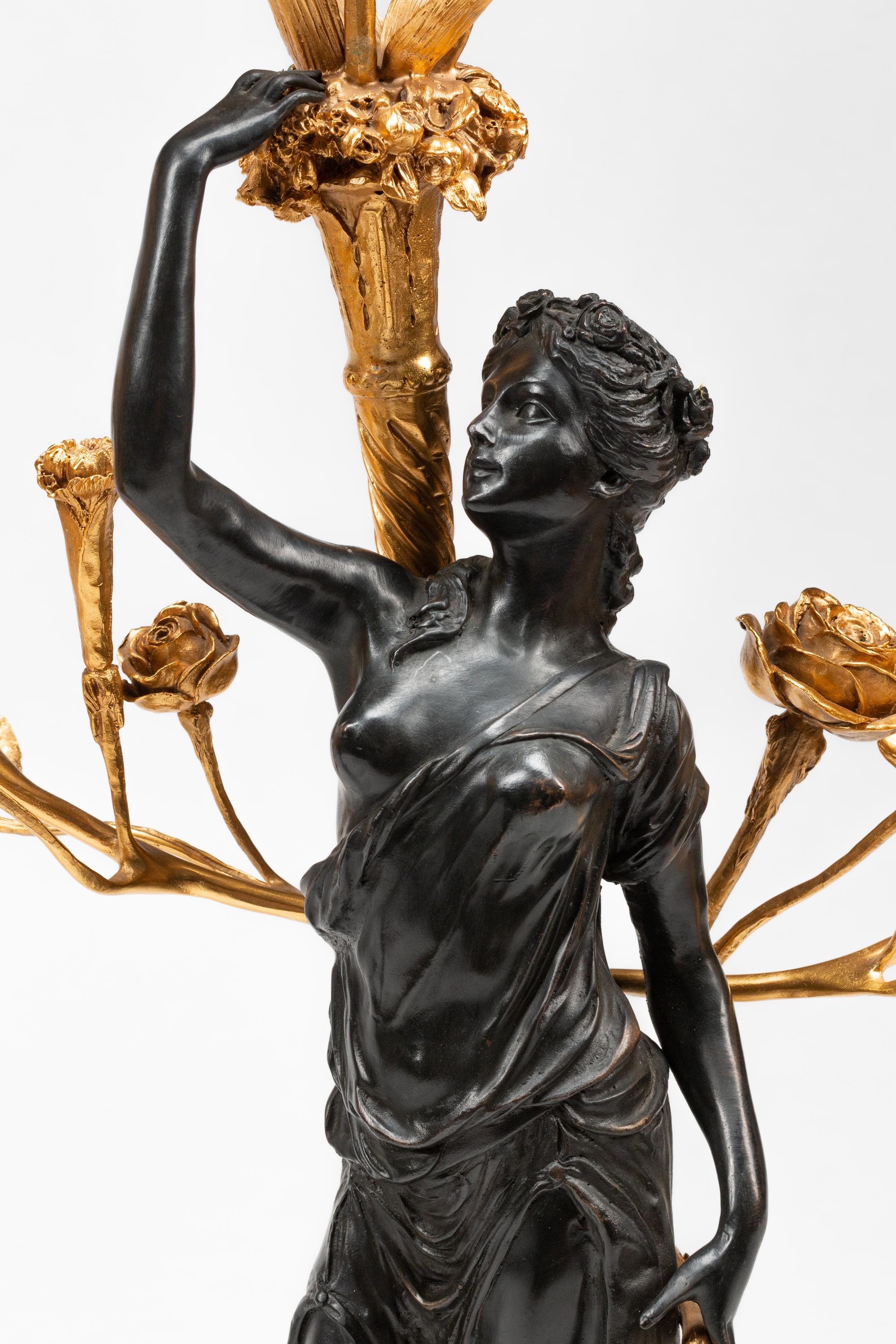 A Pair of French Gilt and Patinated Bronze and Marble Figural Three-Light Candelabra